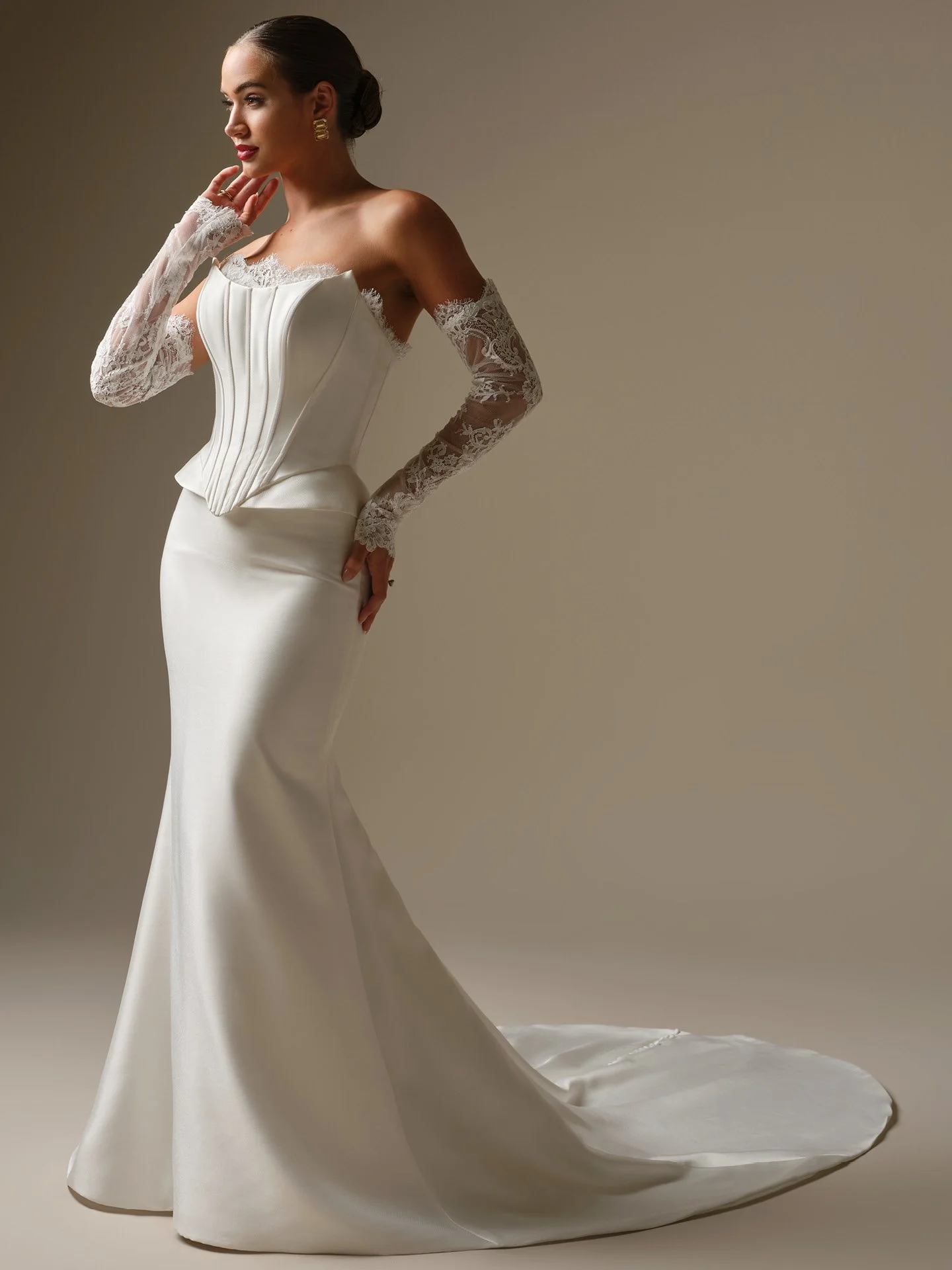 Lassen Marie sleek strapless Mikado sheath wedding dress with corset bodice, cat eye neckline, and peplum hip