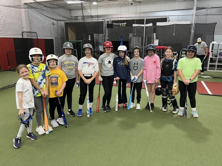 Softball players gathered after training at Swing Zone