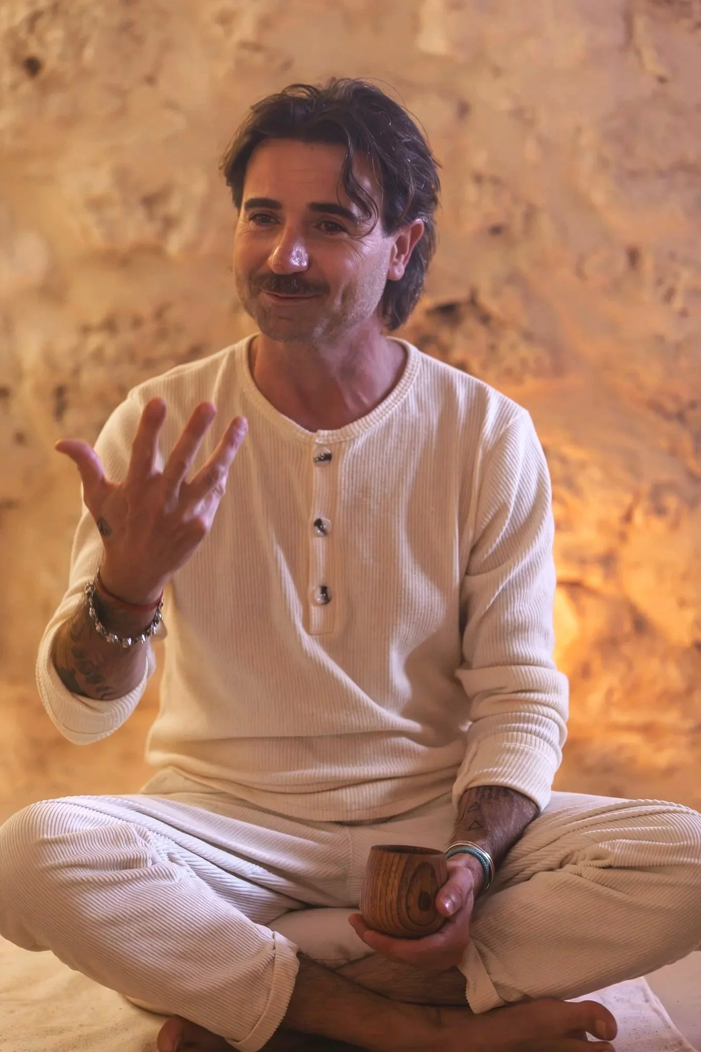 Nikos, Samudra Retreats chef, seated in meditation in the underground cave, embodying the retreat’s slow-living philosophy