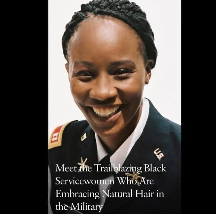 A smiling Black woman in a U.S. military uniform with natural hair, celebrating diversity in the military.