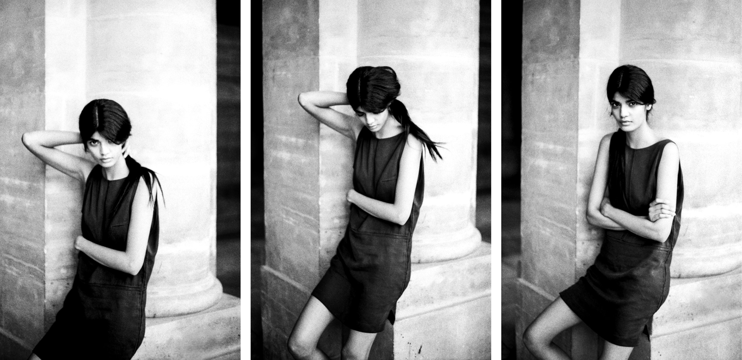 A black-and-white triptych photograph of a woman with dark hair, wearing a sleeveless dress, leaning against a large stone column in different poses in front of a classical architecture background.