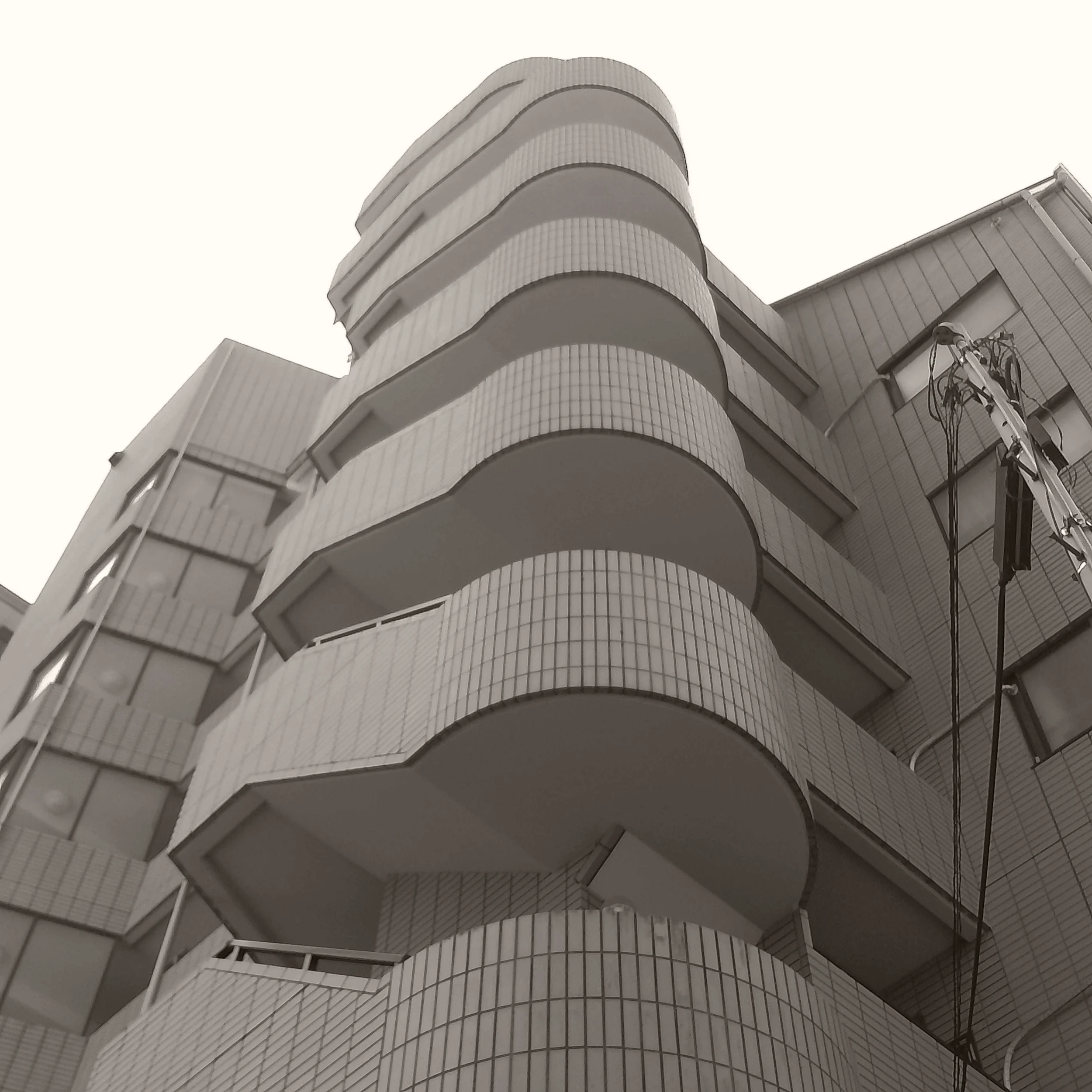 Chuzhao camera photograph of interesting fire escapes on a residential building in Tokyo