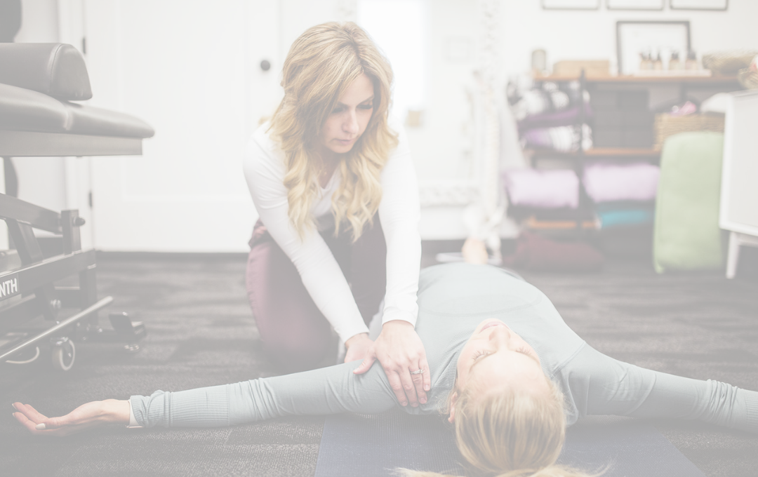 Kim Deschamps practicing physiotherapy on a woman