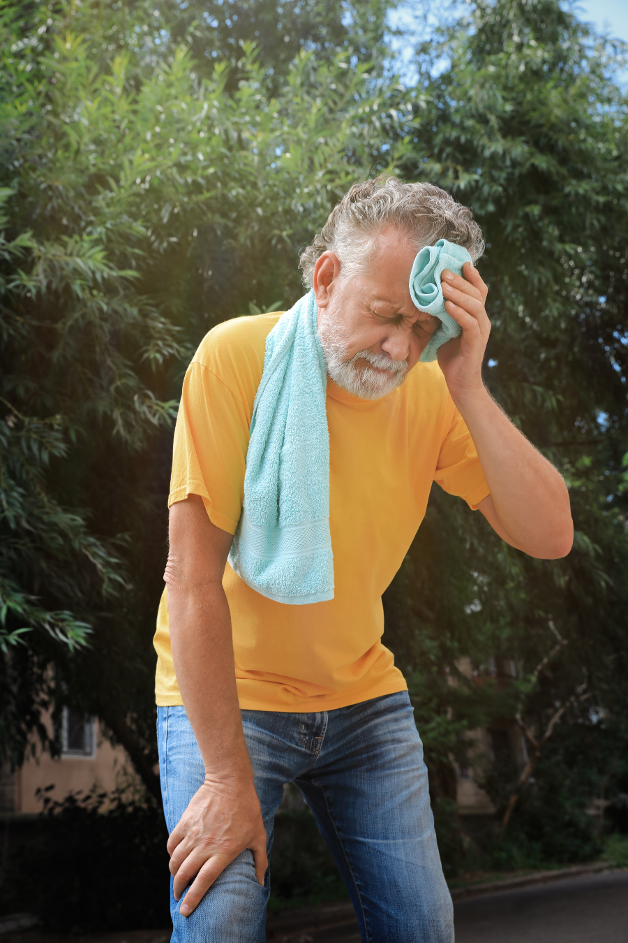 Senior male in the summer heat with towel