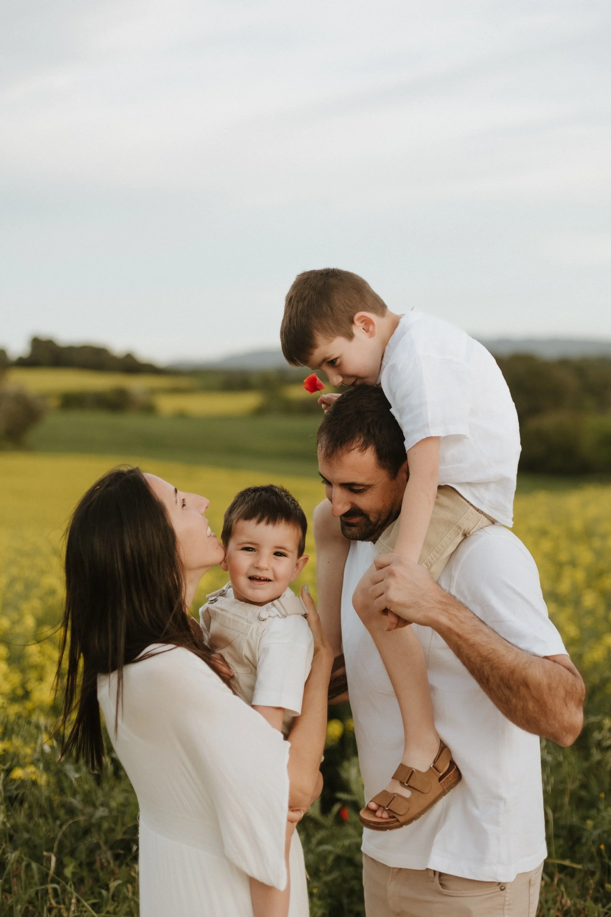 Family enjoying a natural photoshoot outdoors in the Spring at Sunset in Girona, Spain
