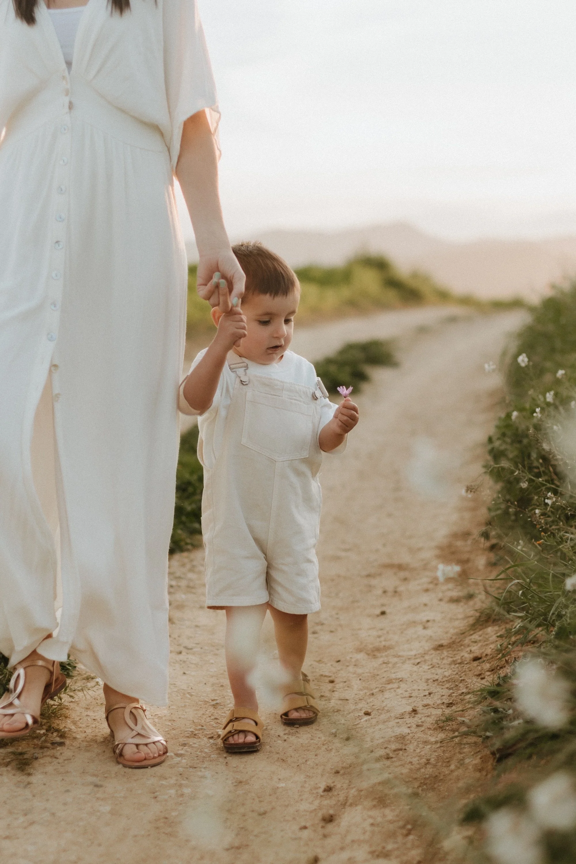 Family enjoying a natural photoshoot outdoors in the Spring at Sunset in Girona, Spain