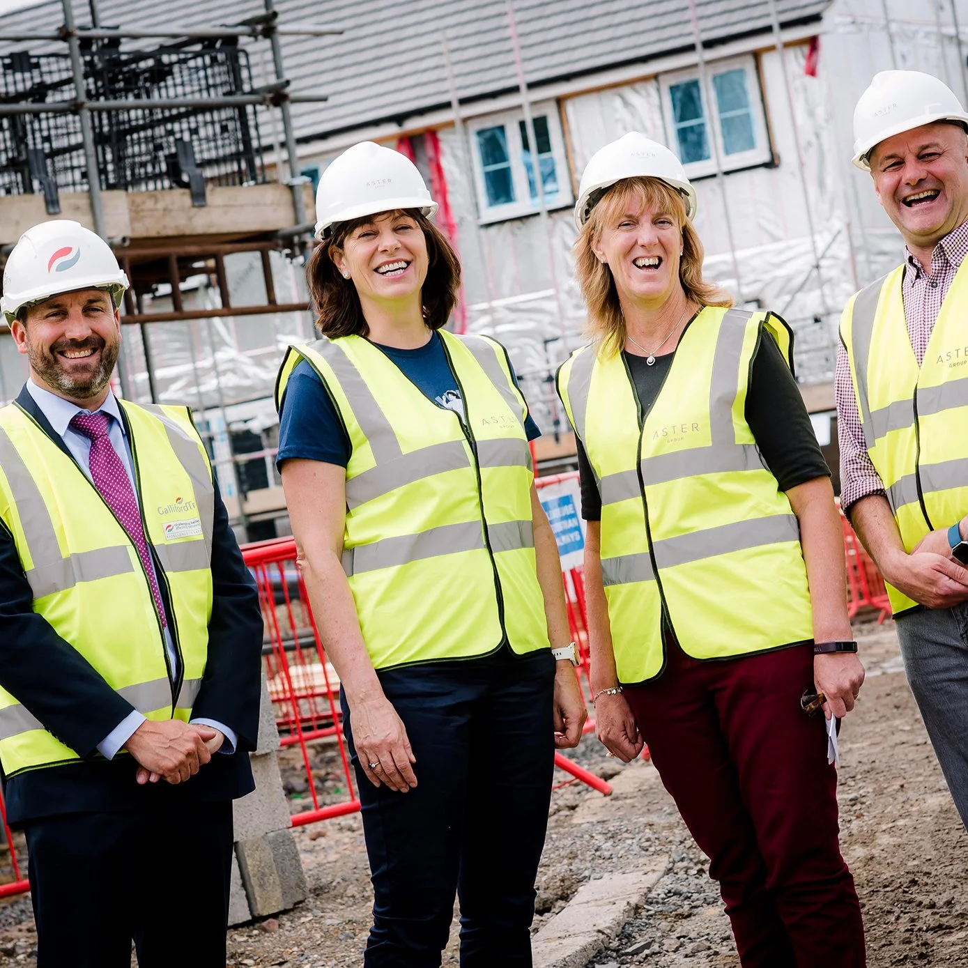 Former politician Claire Perry O'Neill wearing high vis , smiling at a camera during a site visit