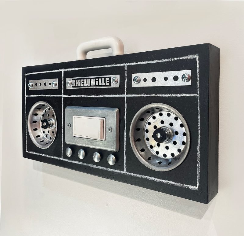 Skewville-Drain-Your-Sorrows-Found-materials-sculpture-16-x-10-x-2.5-2025-500-800x772.jpg