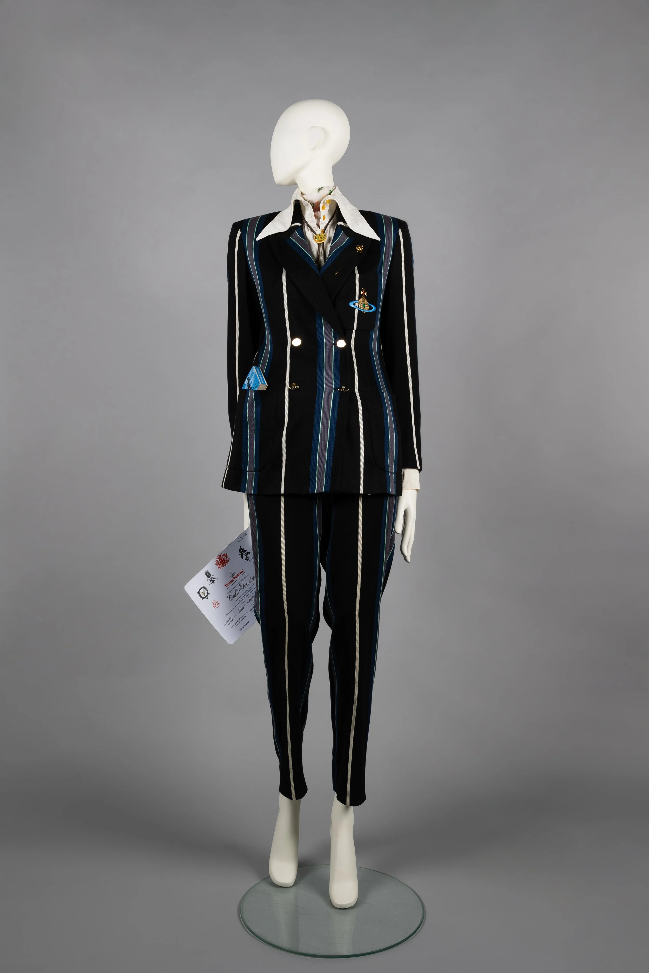 Striped high-waist trouser suit with Jacquard Hals blouse, rose print neckerchief and bolo tie © The Bowes Museum, County Durham. Photography by Claire Collinson.   Café Society, SS 1994.jpg