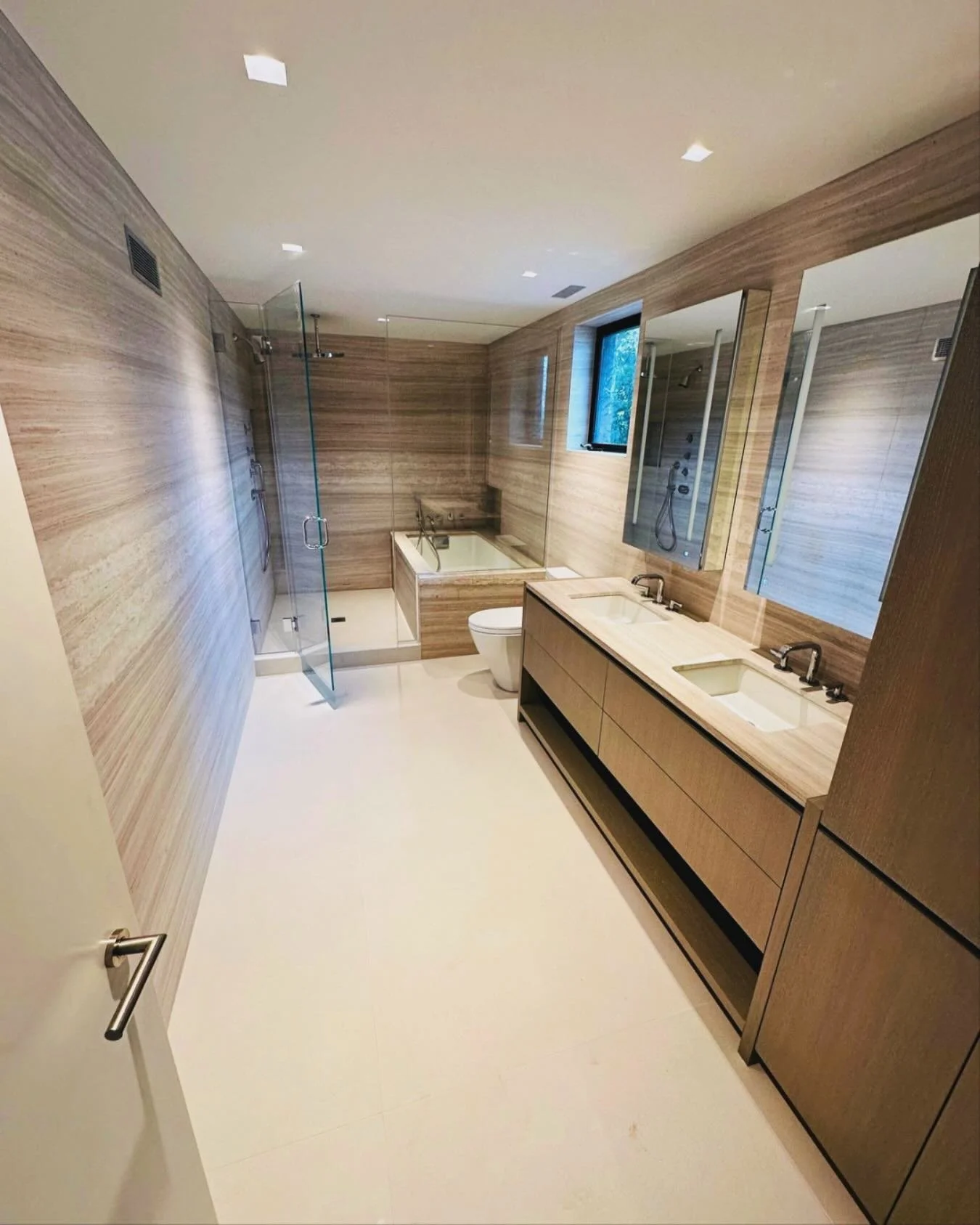 White Wooden Travertine 
Sleek lines and Sophisticated finishes 

Fabrication and Installation by @jvstonedesign 
.
.
.
.
#interiordesign #bathroominspiration #design #luxury #luxurydesigns #bathroomgoals #tranquility #homedecor #instagood #love #int