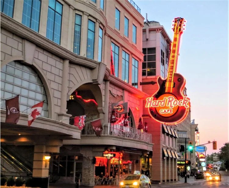 Hard Rock Cafe Niagara Falls exterior at dusk with its giant guitar sign