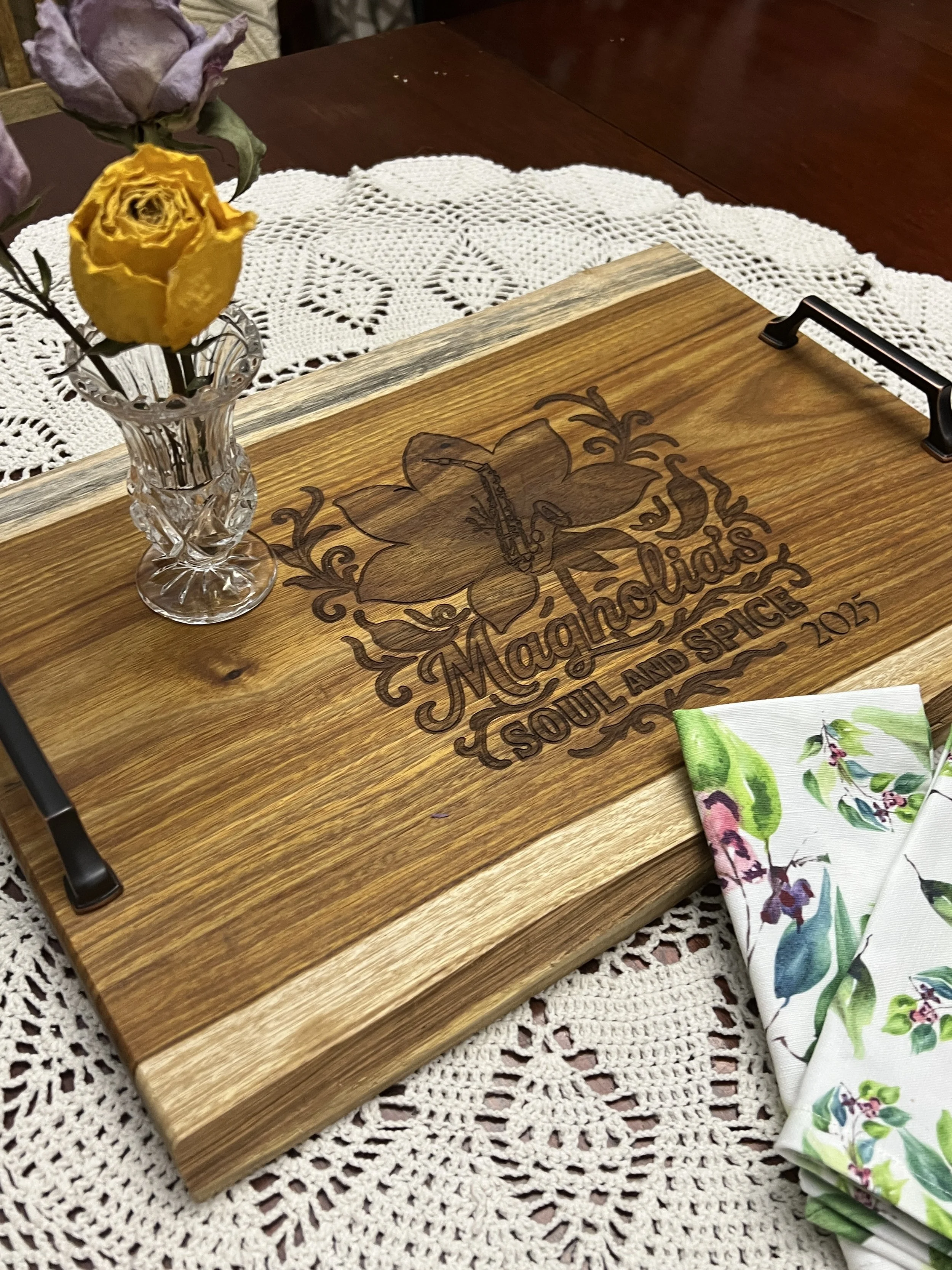 Two wooden charcuterie boards overlapping on a light background.