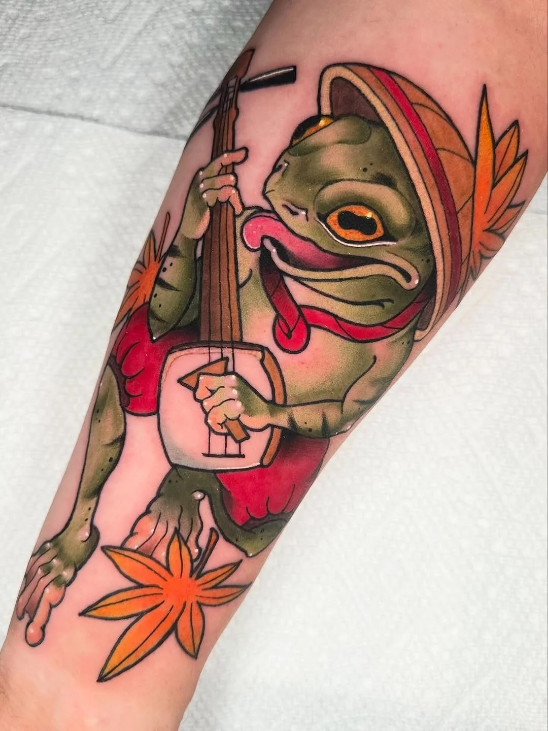Frog tattoo by resident artist @lexiwtattoos
&bull;
Froggie playing his shamisen🐸 done @folkloretattoocompany 
&bull;
&bull;
&bull;
&bull;
@kingpintattoosupply 
@crybabytattooproducts 
@fkirons
@eternalink 
@heliostattoo 
#frog #frogtattoo #shamisen