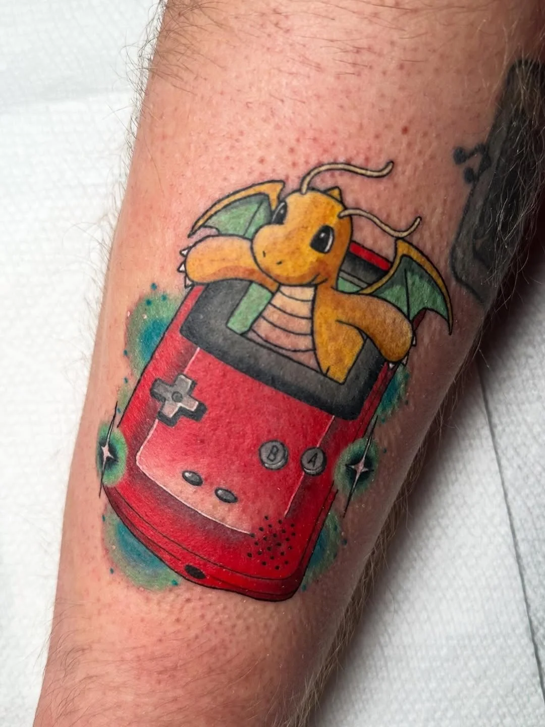 Pok&eacute;mon gameboy tattoo by resident artist @lexiwtattoos
&bull;
Cool little Dragonite gameboy for Kam!
Done @folkloretattoocompany 
@kingpintattoosupply 
@crybabytattooproducts 
@fkirons 
@eternalink 
&bull;
&bull;
&bull;
&bull;
#pokemon #pokem