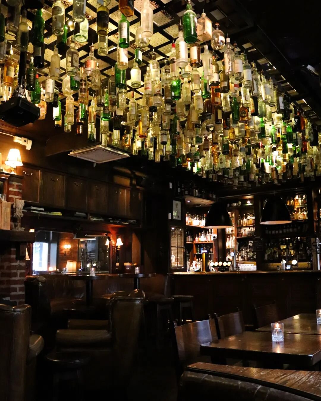 The most photographed feature of our Bar: the Whisky Bottle Ceiling.
...But one of them is actually not a Whisky Bottle. Come by and find the odd one out! 😉🥃