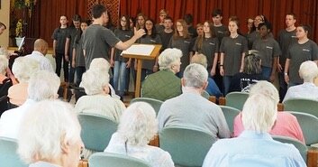 The Youth Choir from St Andrew United Methodist Church Choir Texas enjoy visiting a retirement home in London to perform for the residents and members of staff during their 2018 concert tour to England.