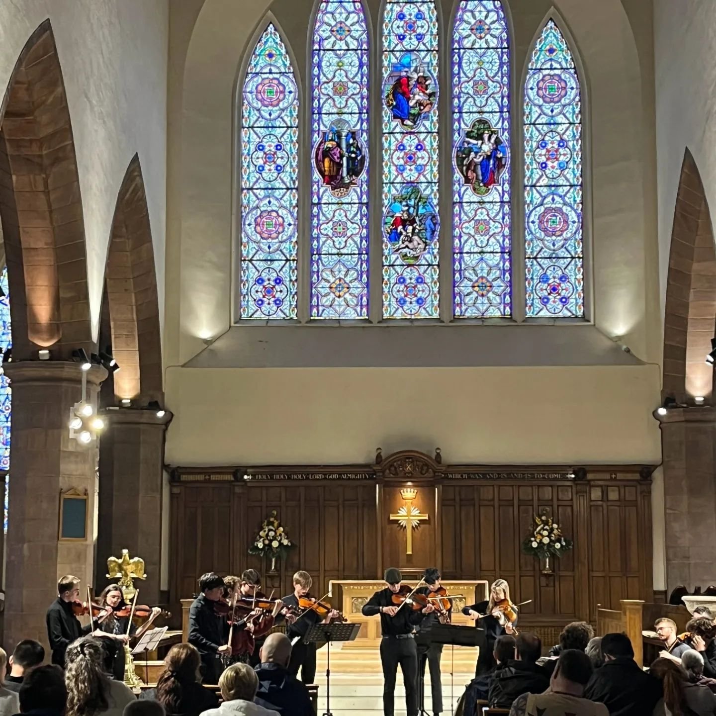 The St Xavier High School Men in Black string orchestra enjoying performing in Edinburgh during their 2024 tour of Ireland and Scotland.