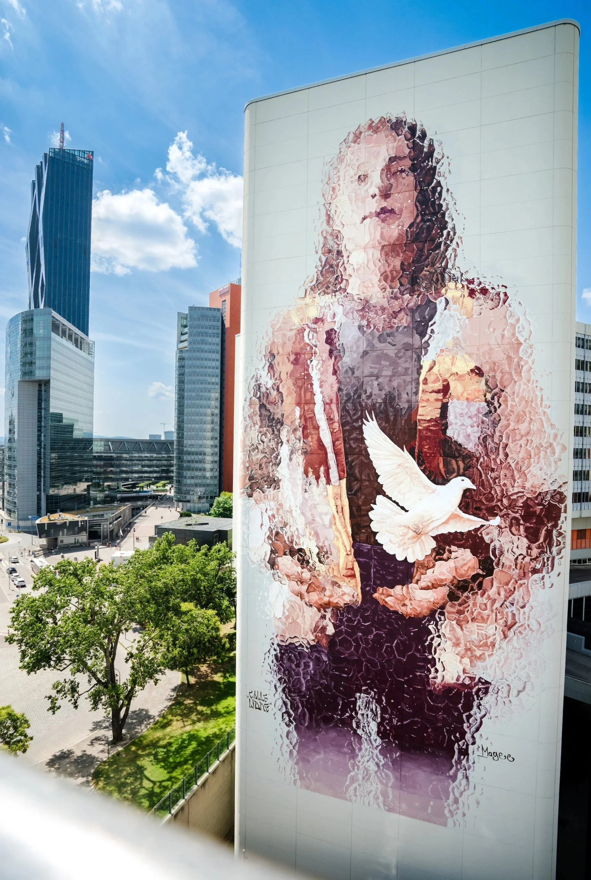 Mural woman with dove for United nations in Vienna Austria by Fintan Magee australian mural artist