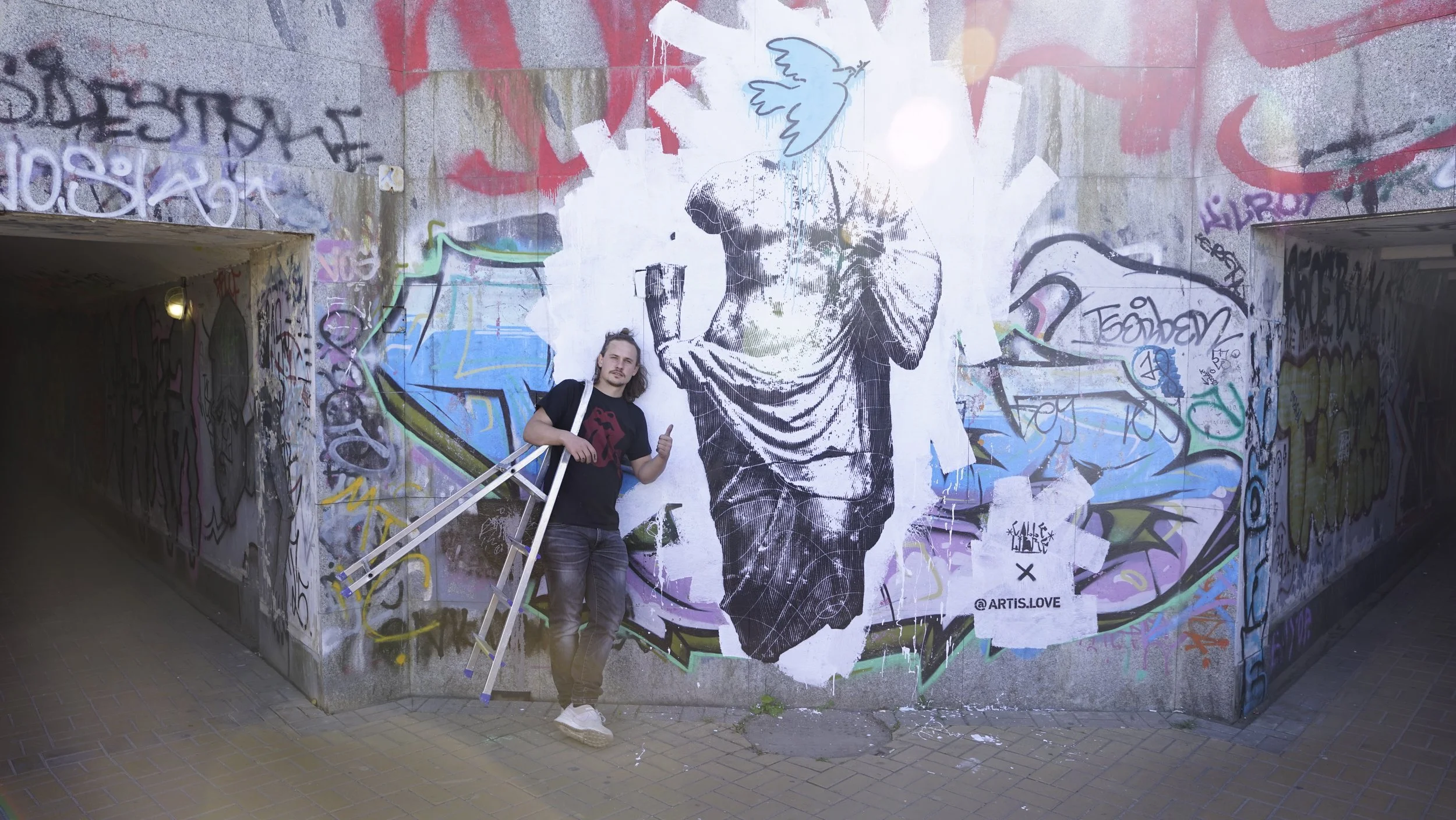Austrian artist Artis.love with Calle Libre street art festival in Kiev Ukraine as a part of Austrian-Ukrainian cultural exchange