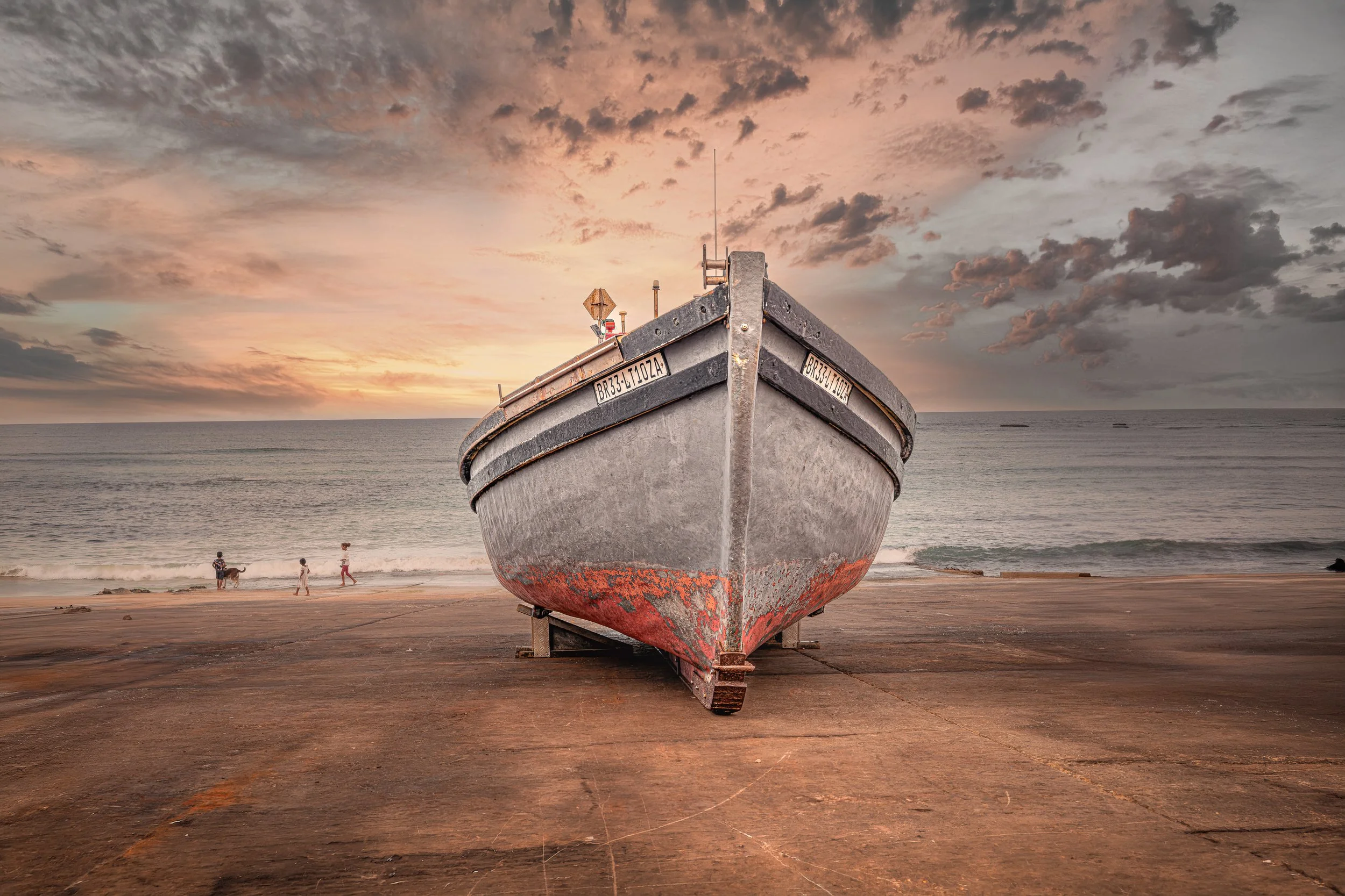 Arniston fishing Boat BR33 on landing at sunset