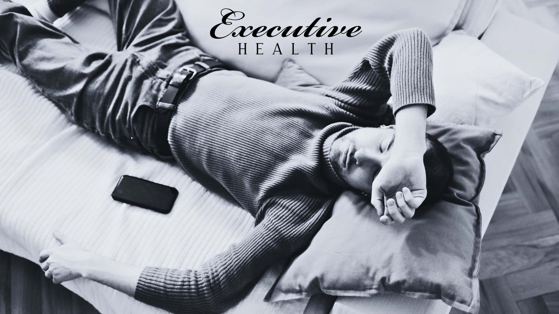 Clock glowing in dark office, representing disrupted circadian rhythm