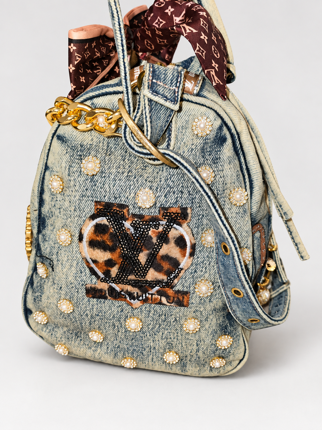 Handmade denim handbag, studio view.png