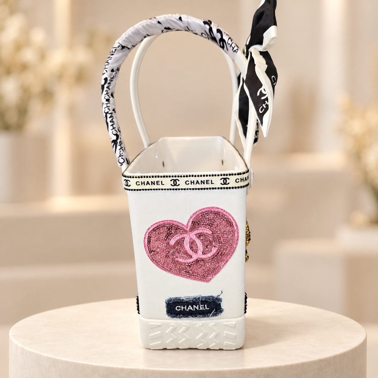 Handmade white tote on ivory pedestal(1).png