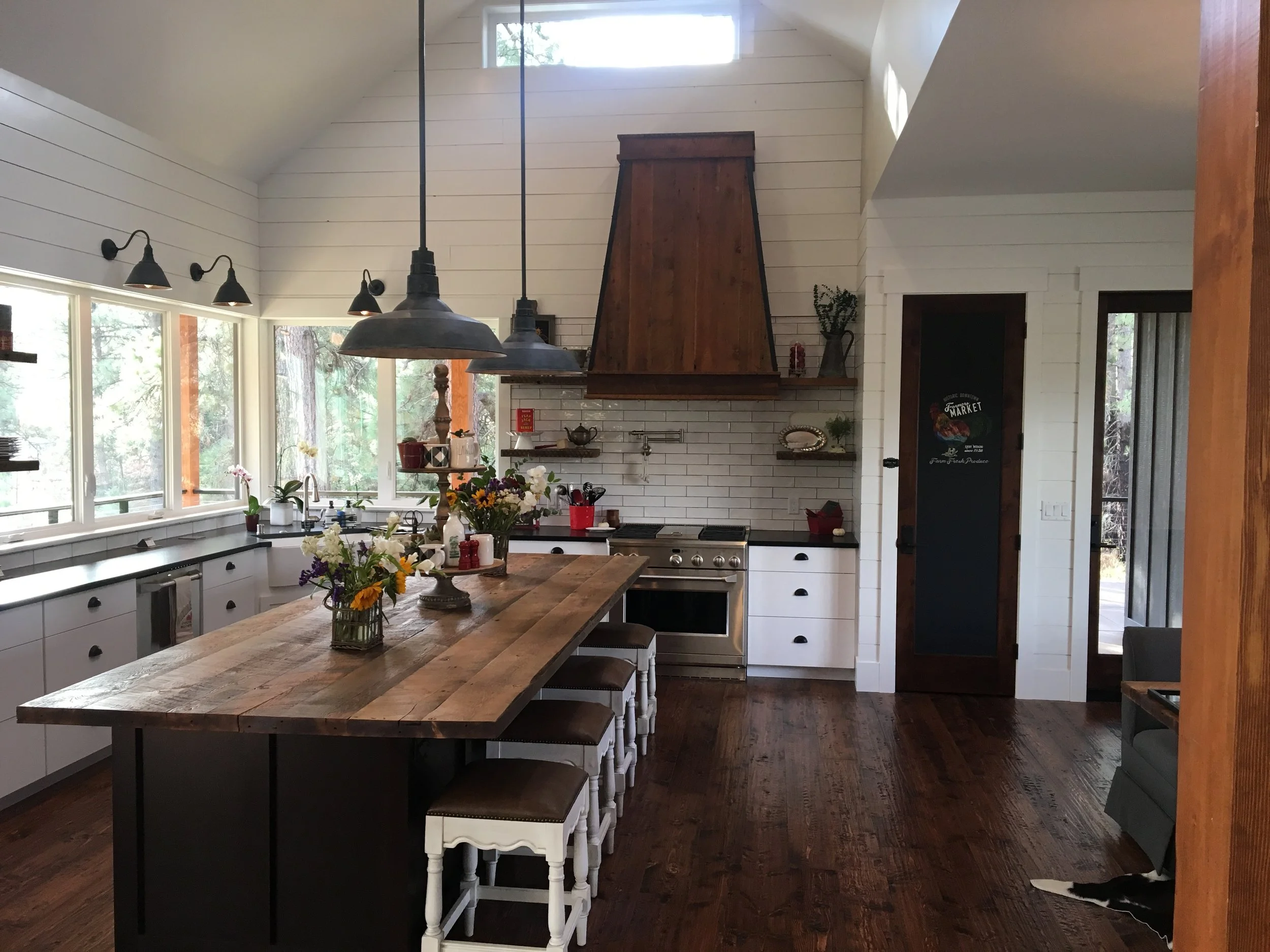 Custom kitchen island top and range hood made from timbers reclaimed from the Missoula Mercantile