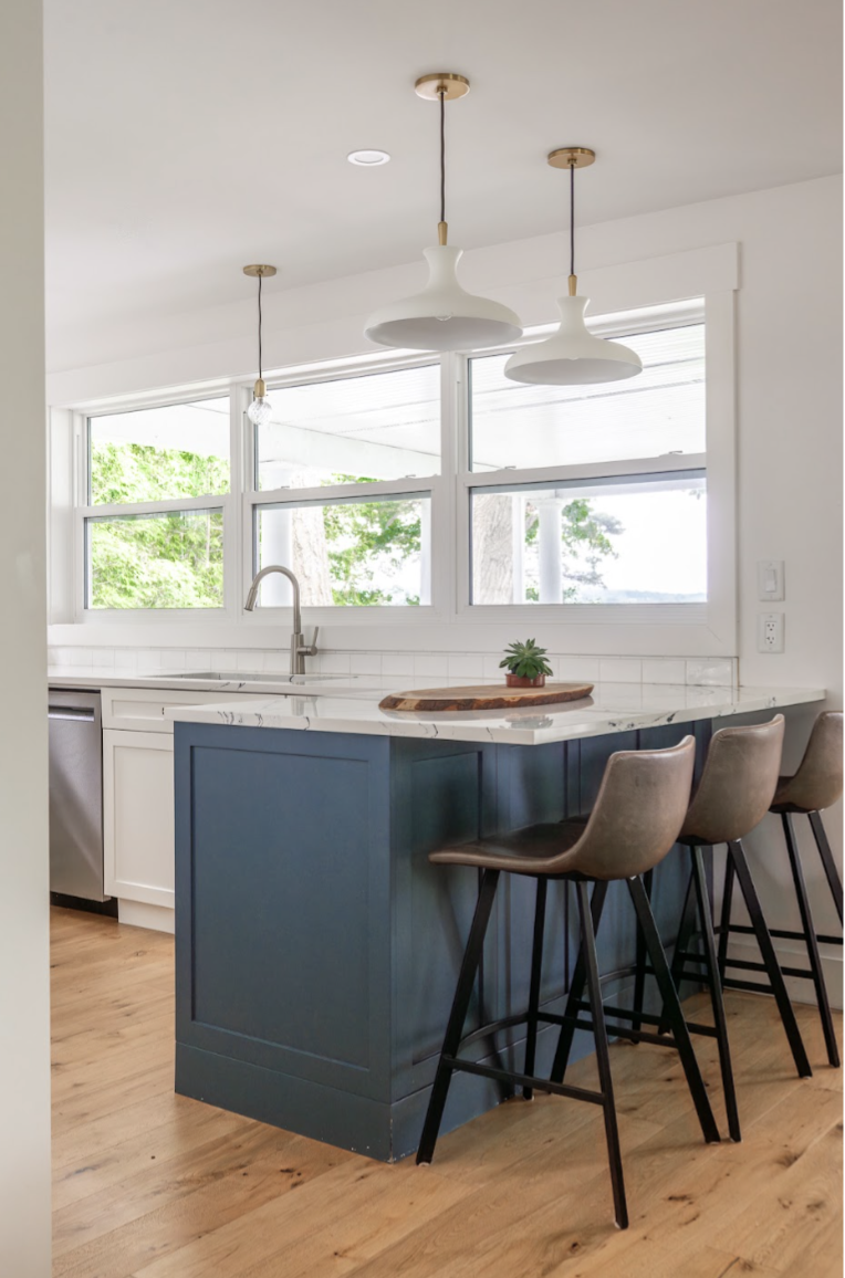 An additional over the sink light provides more task lighting yet with its subtle design doesn’t deter from the outside view.