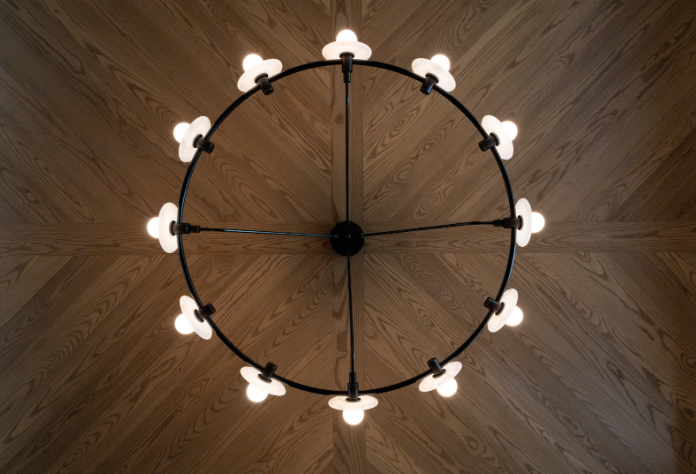 With the wood ceiling design, the chandelier becomes artful and a conversation starter!