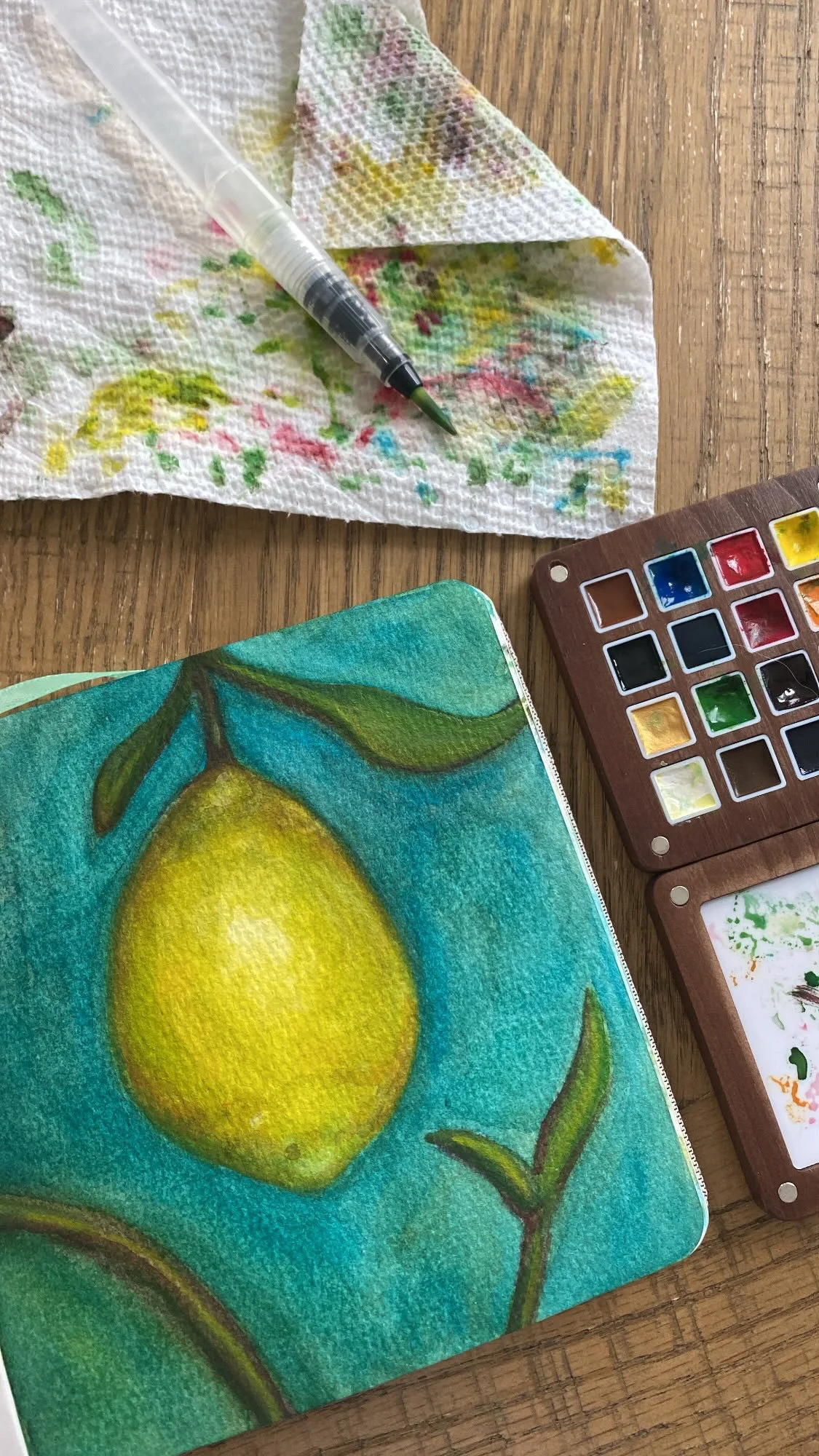 Watercolor lemon with complementary tones underlay.