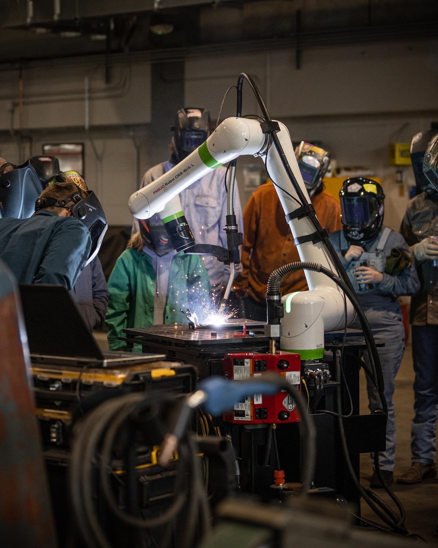 |Students at Linn-Benton Community College making welds in minutes on a Cobot.|
