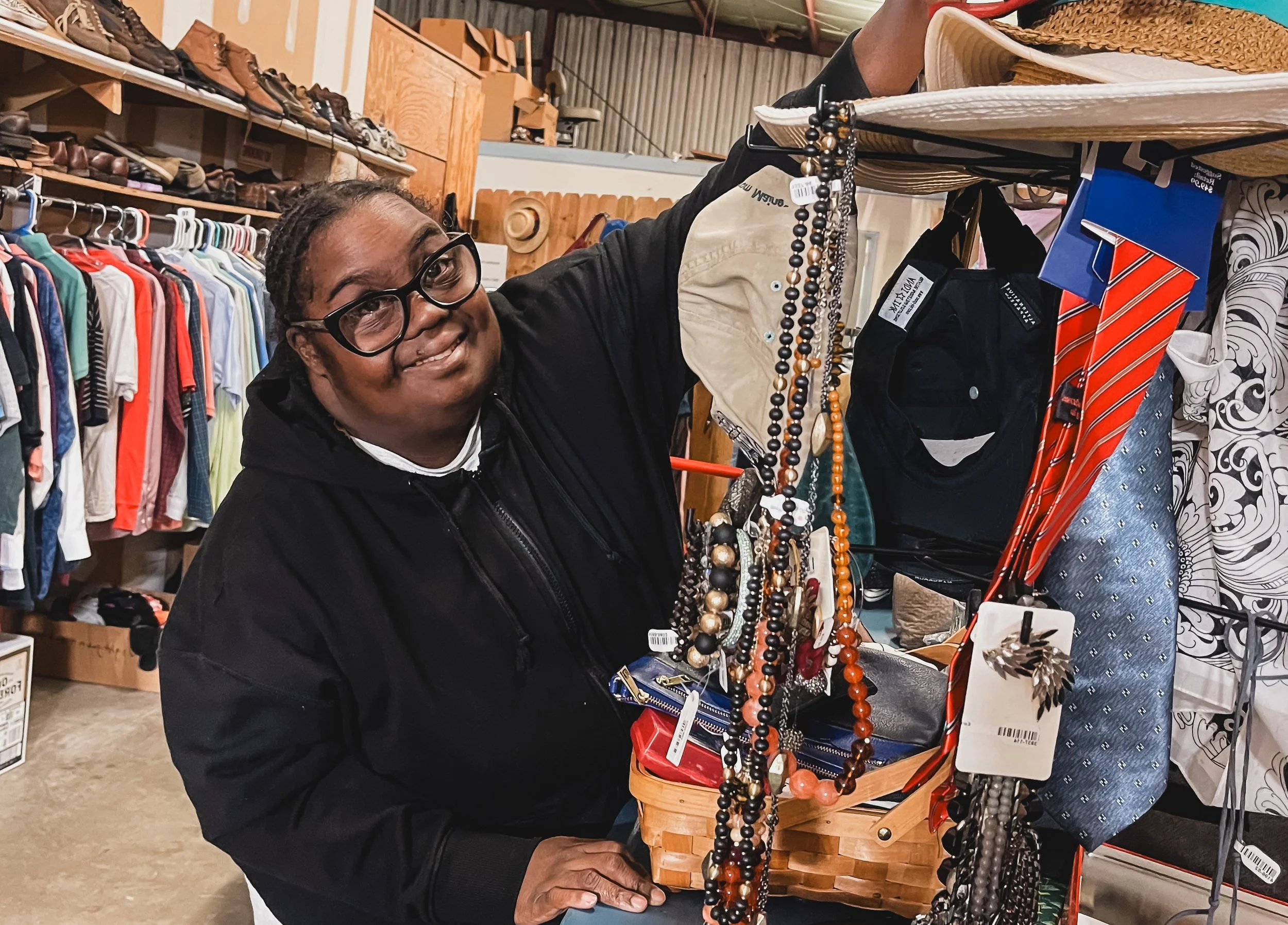 Image shows two participants packing up boxes of food as volunteers through EmployAbility's Community Access Group.