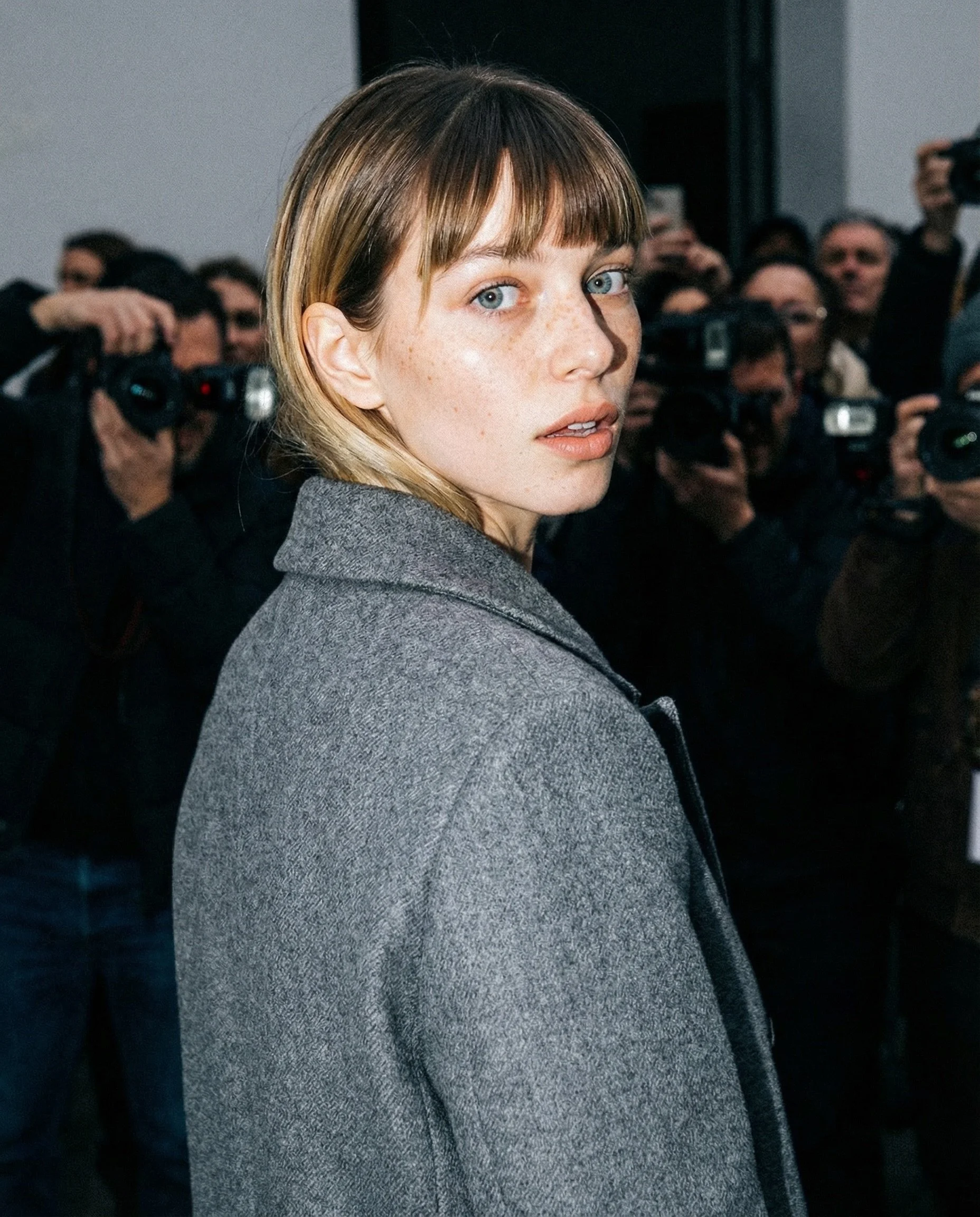 Firefly_Gemini Flash_Paparazzi style close-up shot, caught off-guard moment, woman turning back over shoul 428166.jpeg