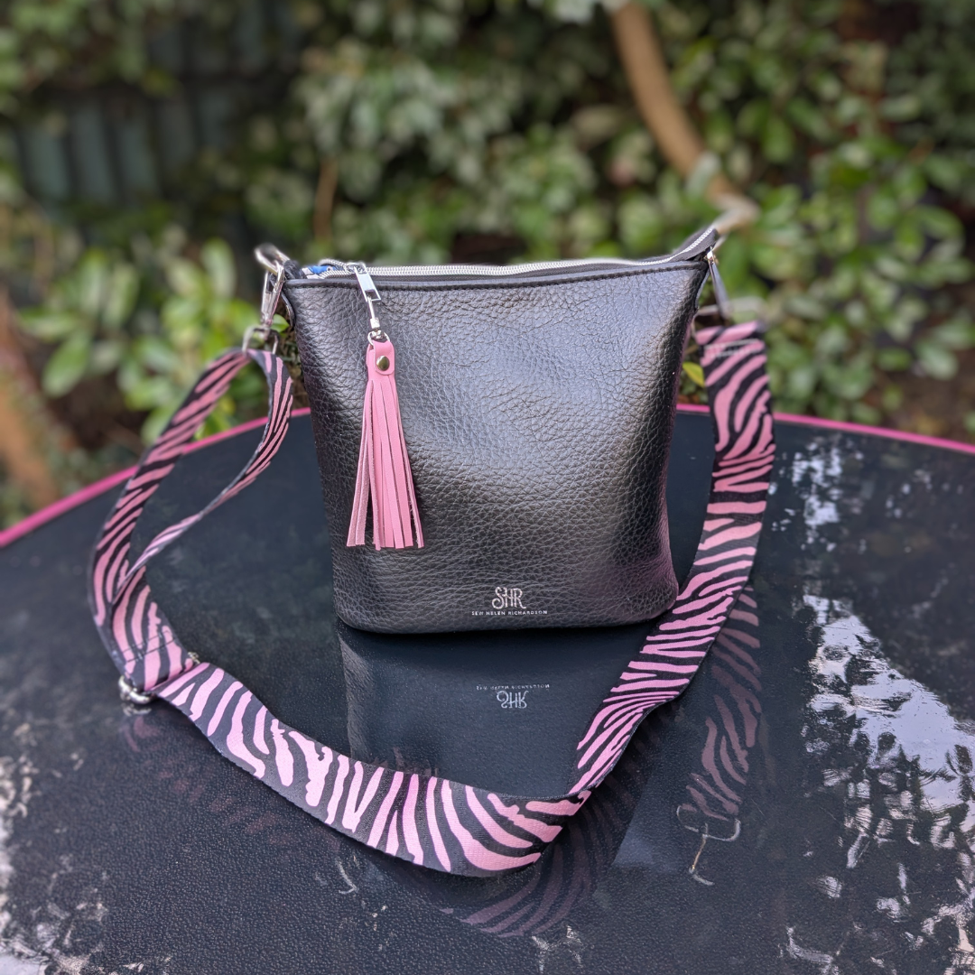 black bucket with pink.png