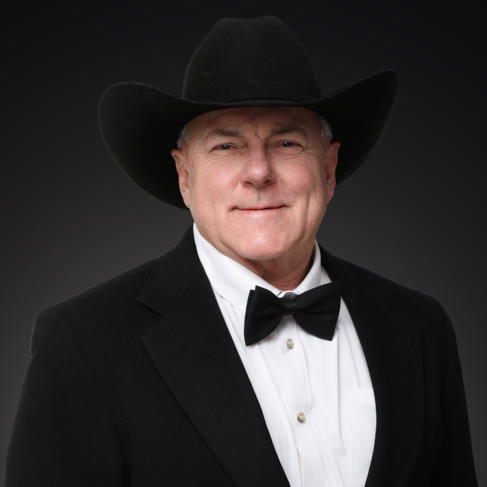 Man in black tuxedo with bow tie and white pocket square I Scott Brown Properties I Denton, TX