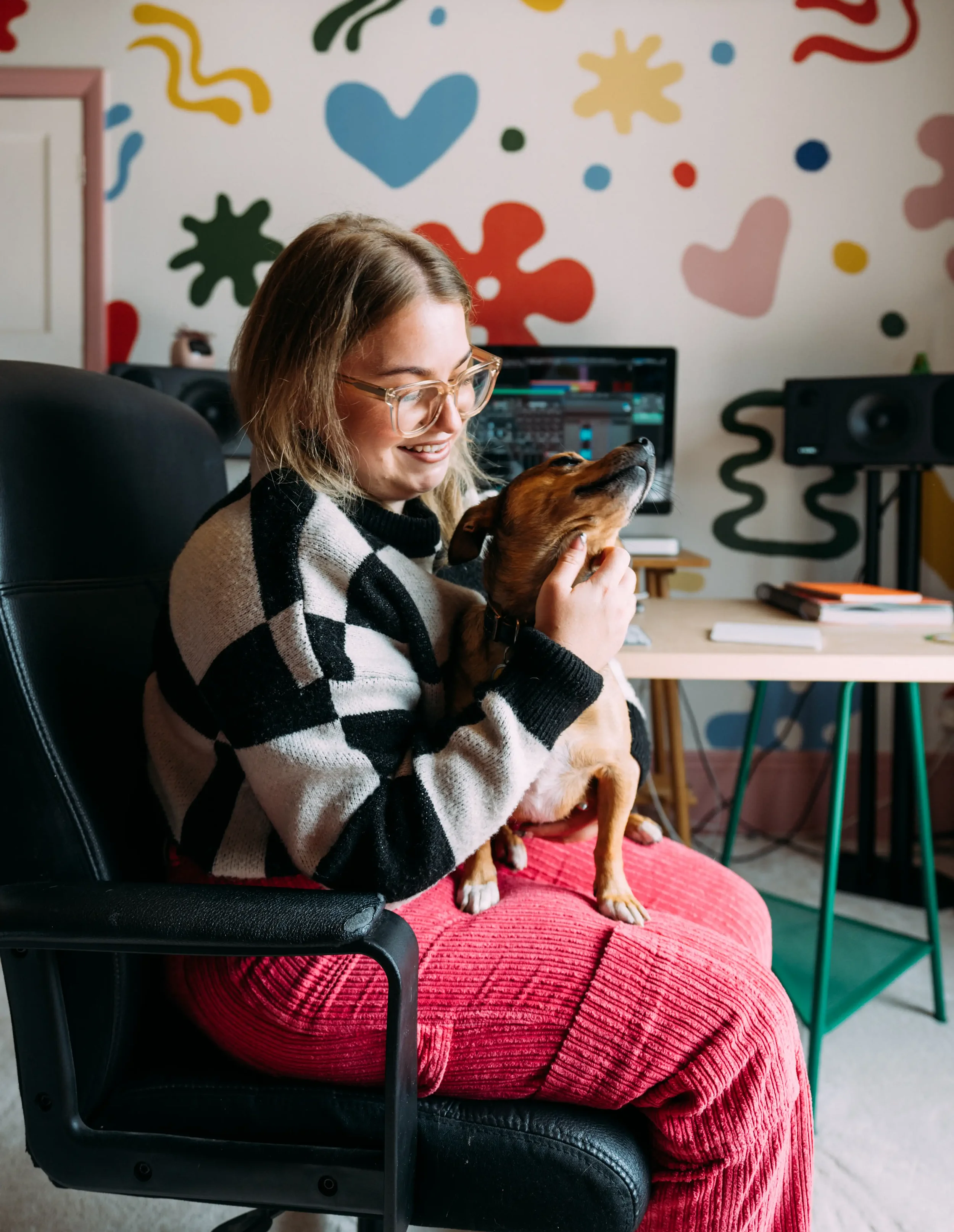 Bristol-based mastering engineer Izzy McPhee and her dog "Pig" at her home studio