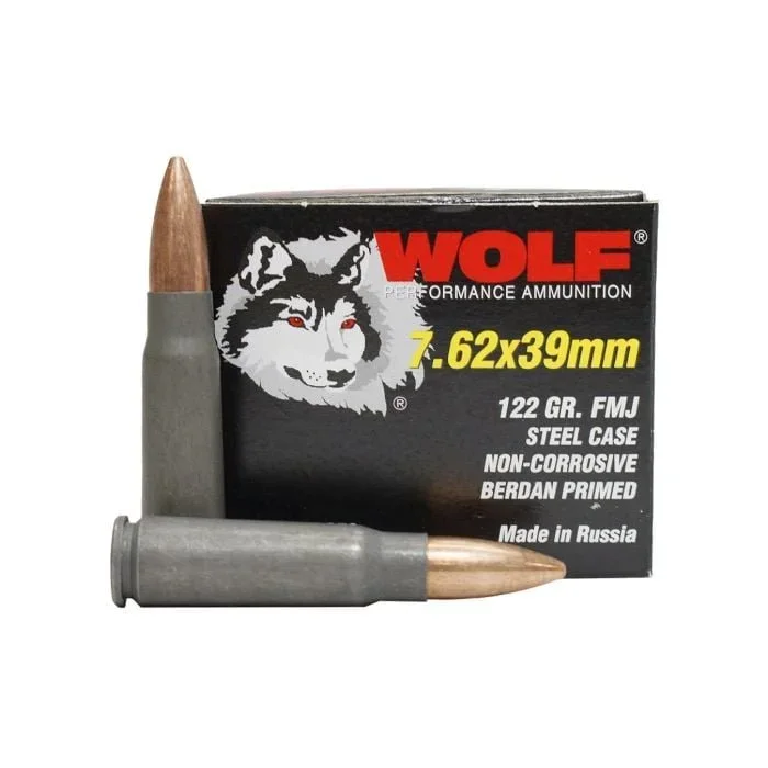 A box of Wolf performace ammunition with a gray bullet and two existing bullets placed in front of the box.