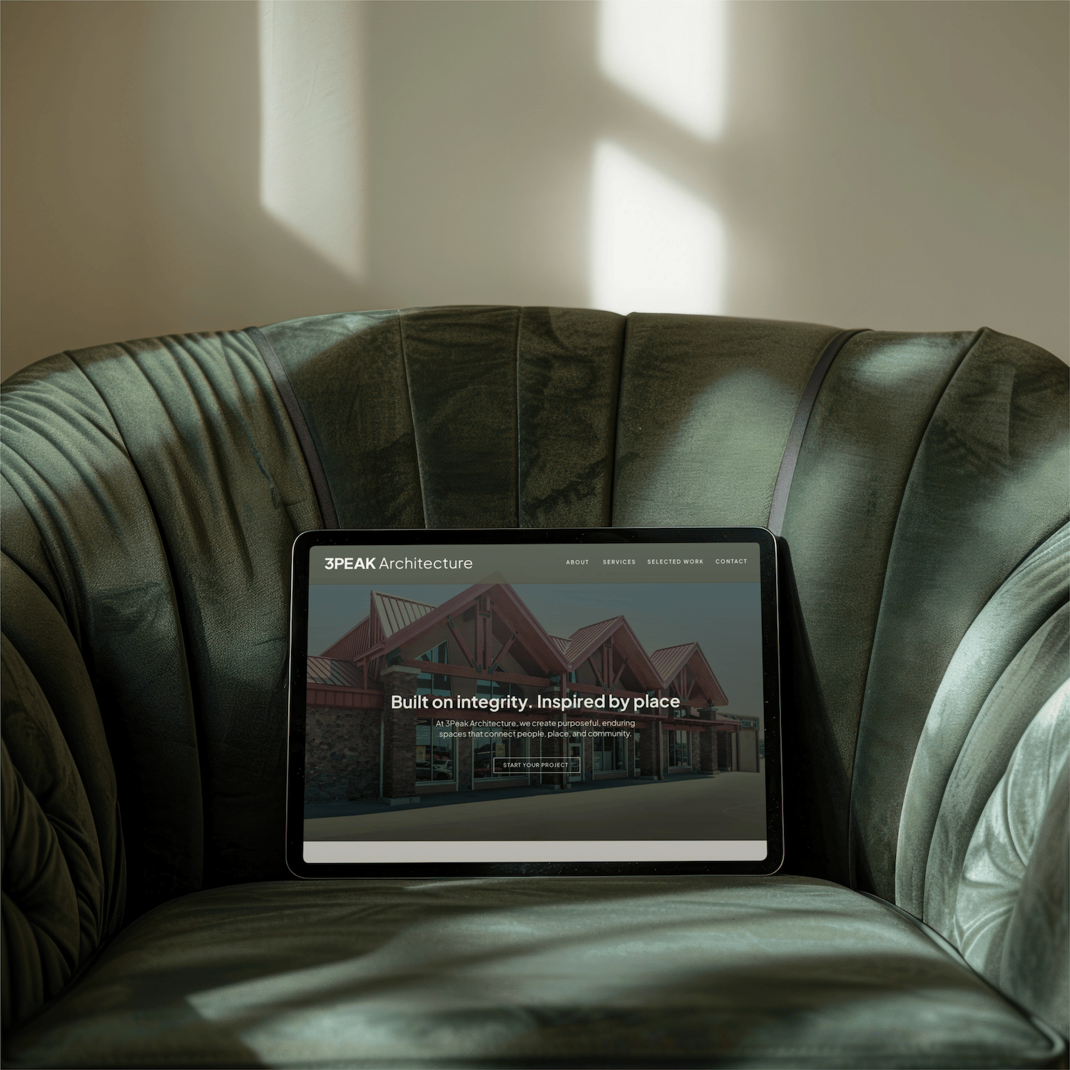 3Peak Architecture website sitting on a chair