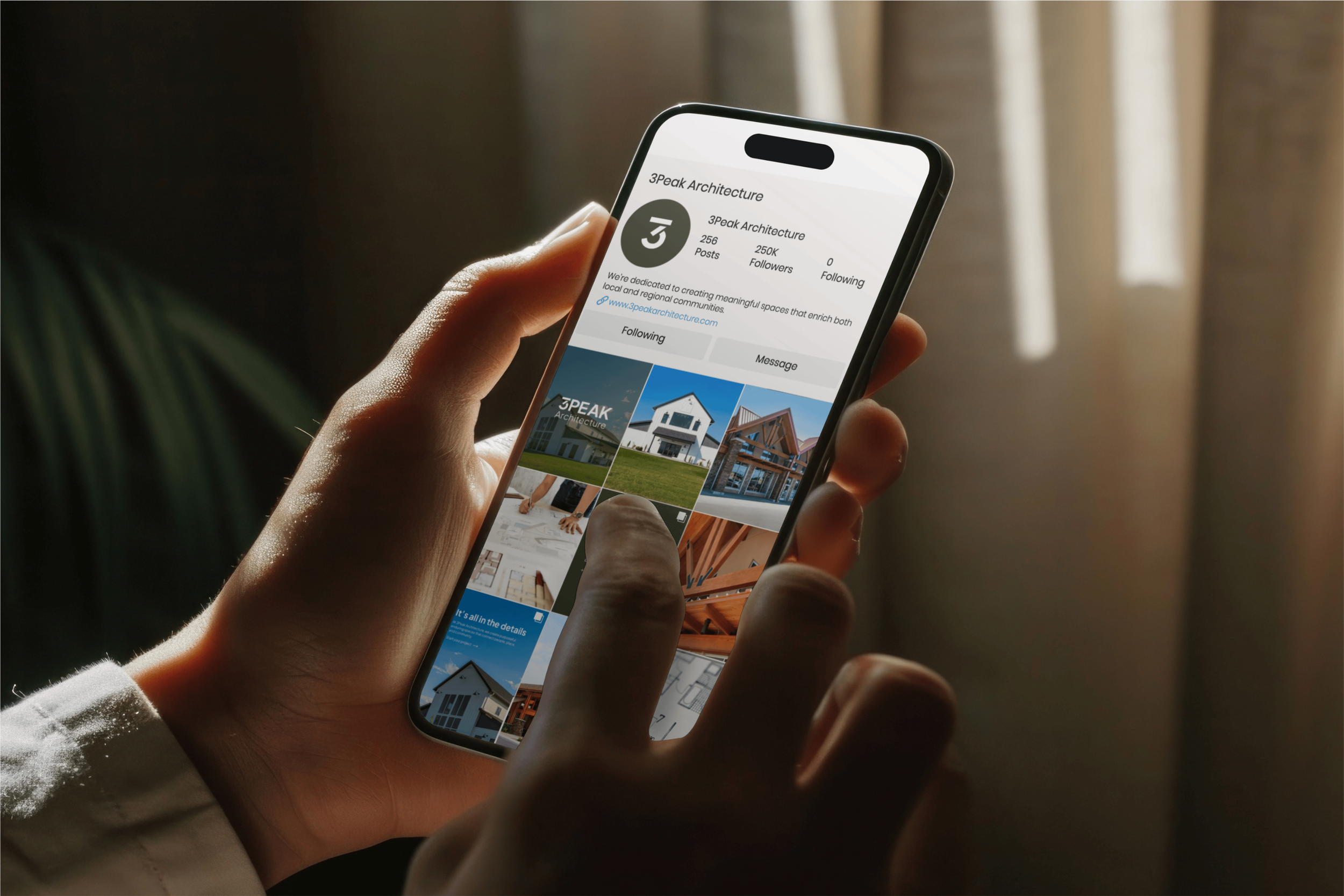 person holding phone with instagram feed on it