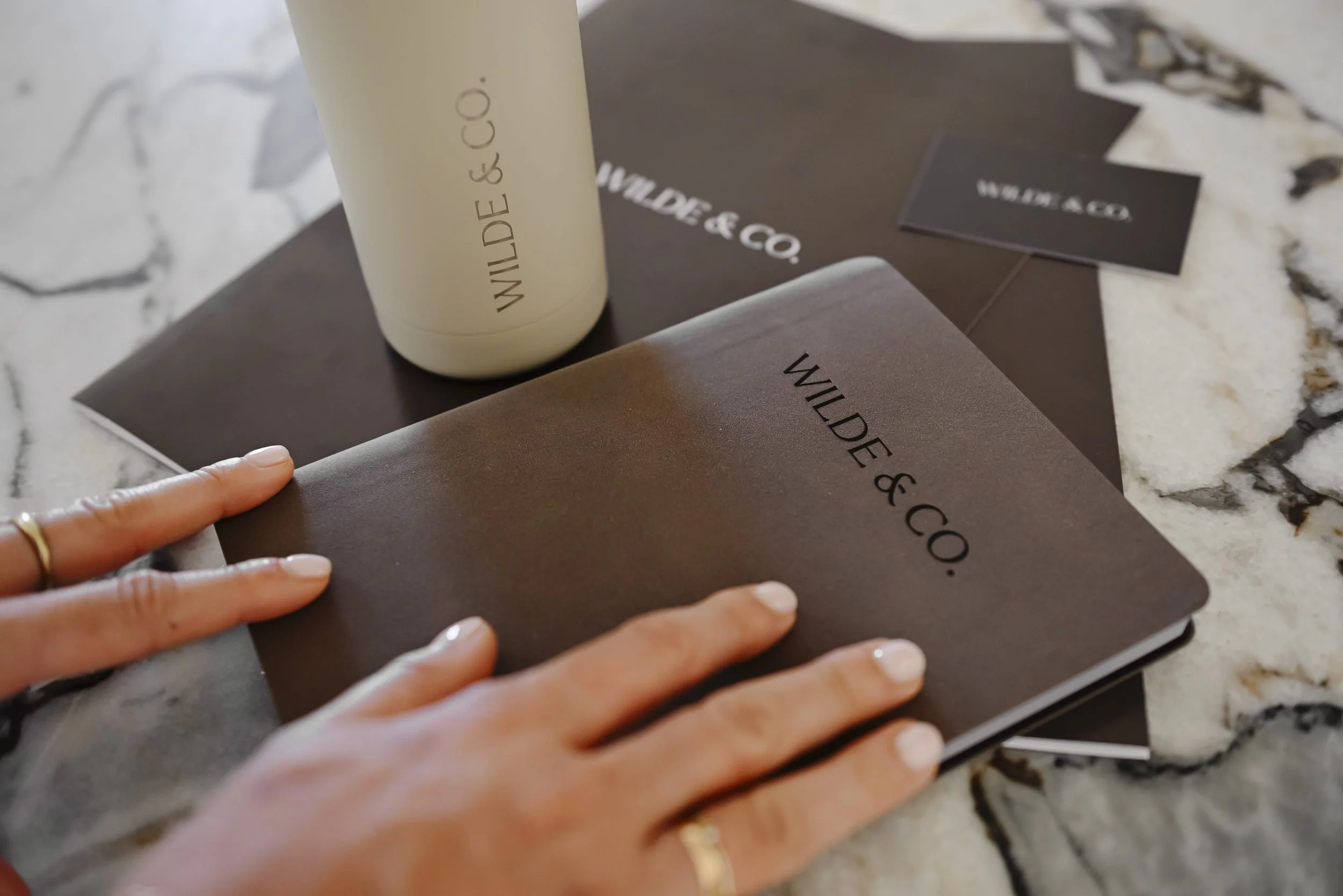 Wilde & Co collateral sitting on a table