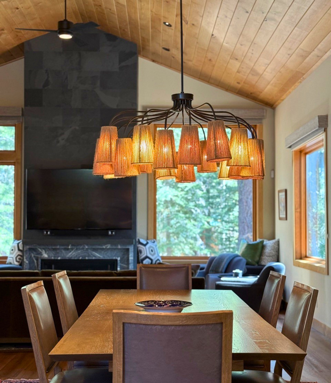Dining room with forest views in a modern Tahoe Donner mountain home designed by Eden Wright Design.