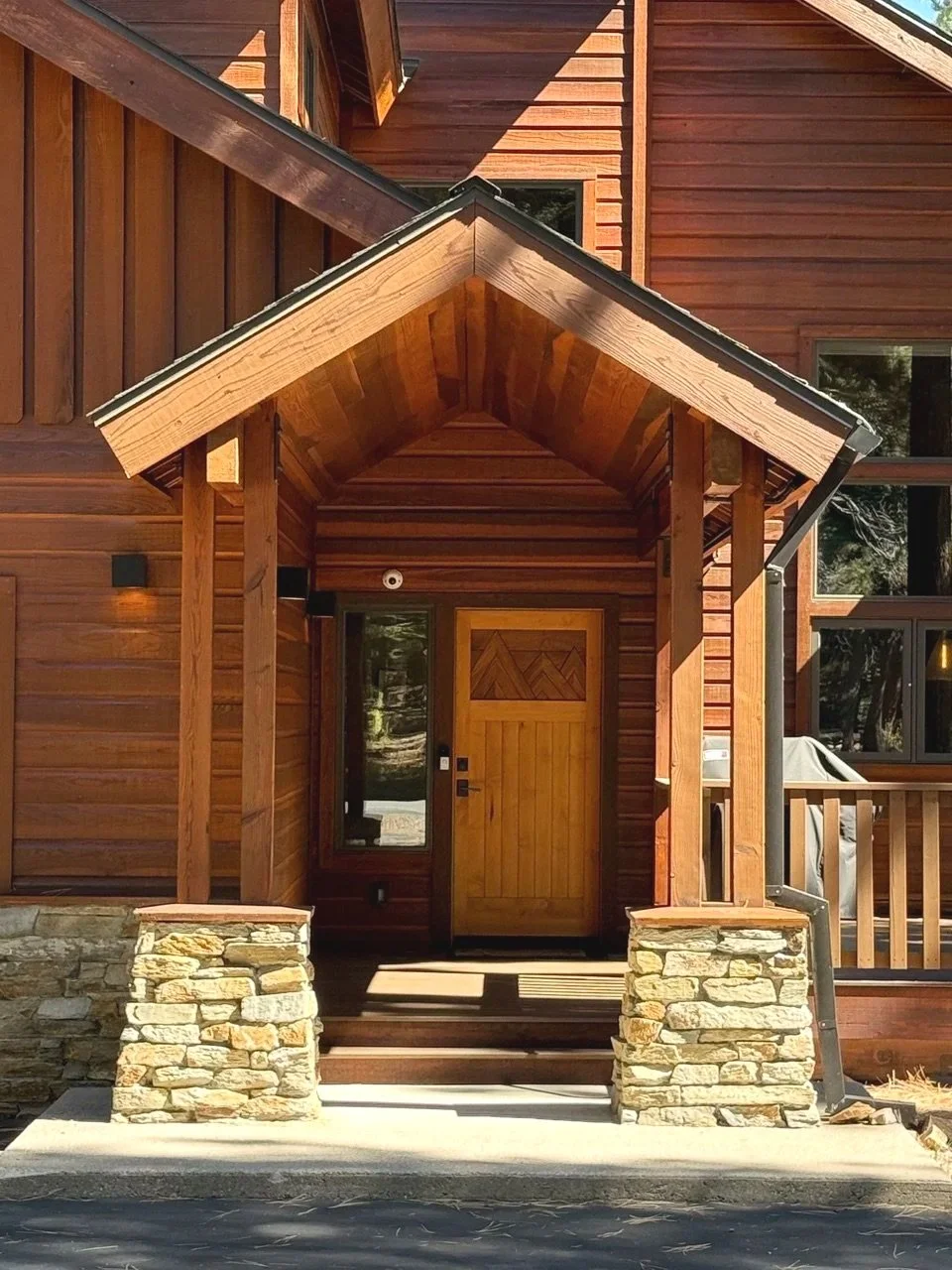 Custom front entry door of a modern mountain home designed by Eden Wright Design in Tahoe Donner.