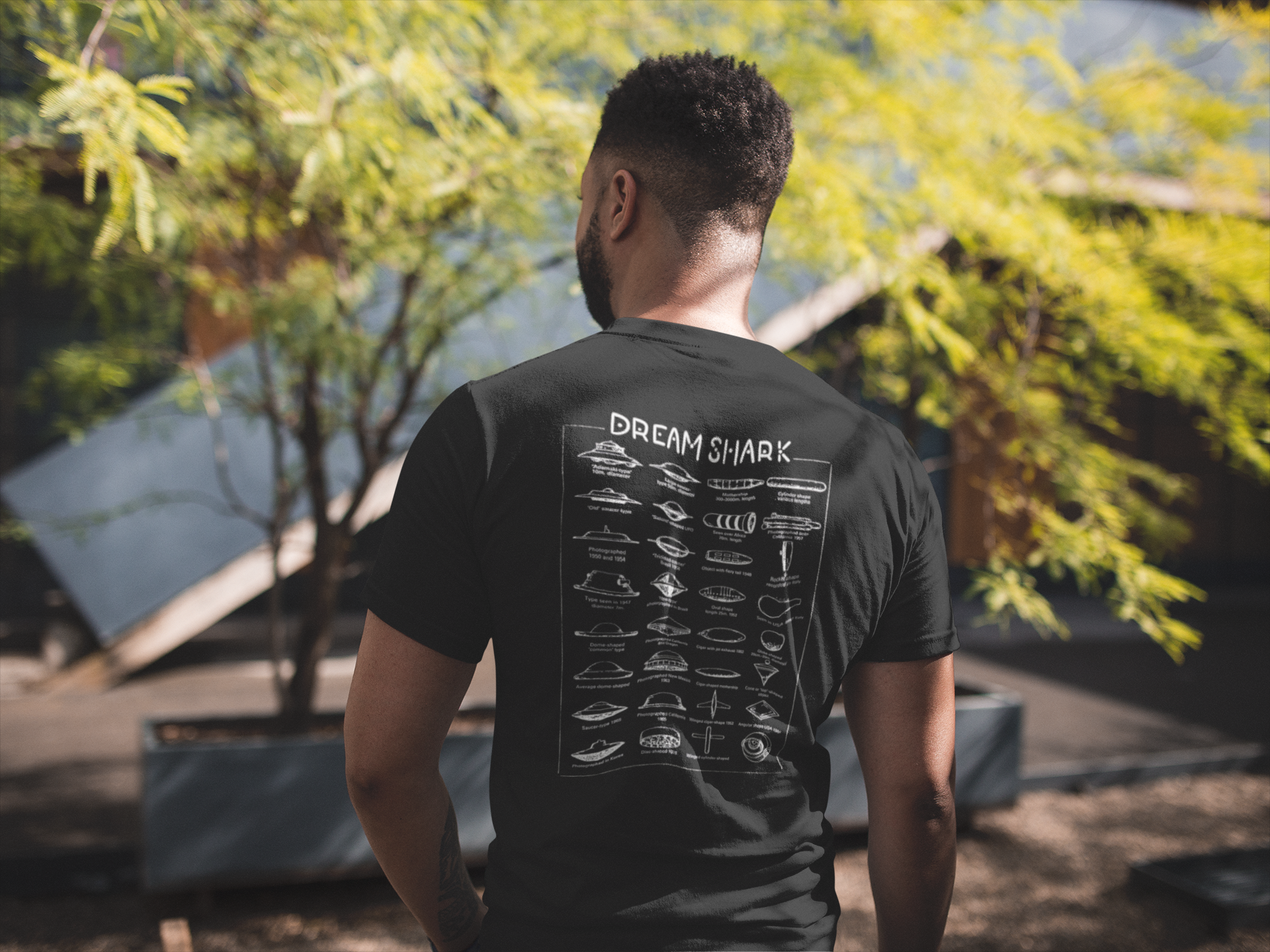 back-view-tshirt-mockup-of-a-man-facing-a-house-and-a-tree-21347.png
