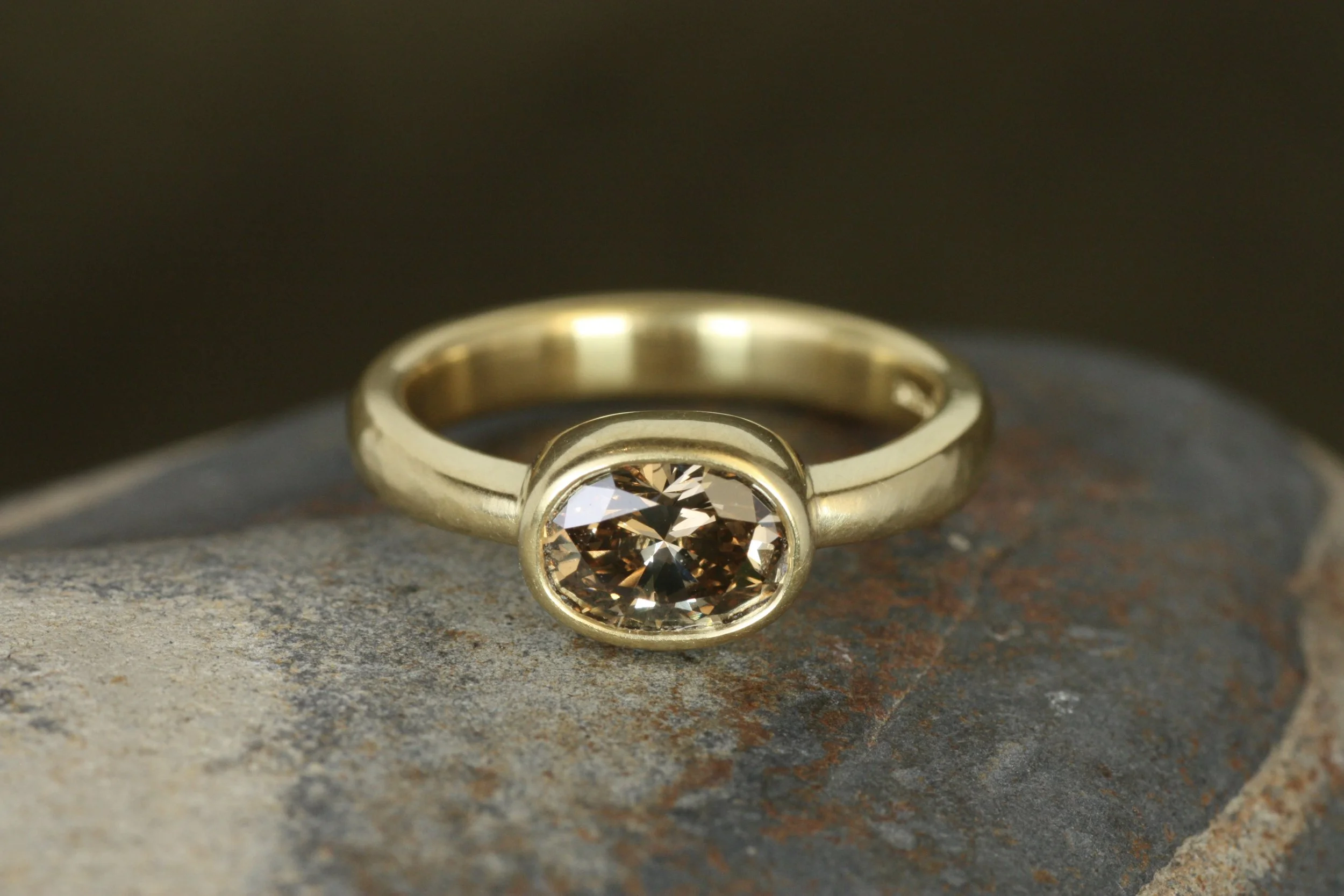 oval brown diamond bezel engagement ring