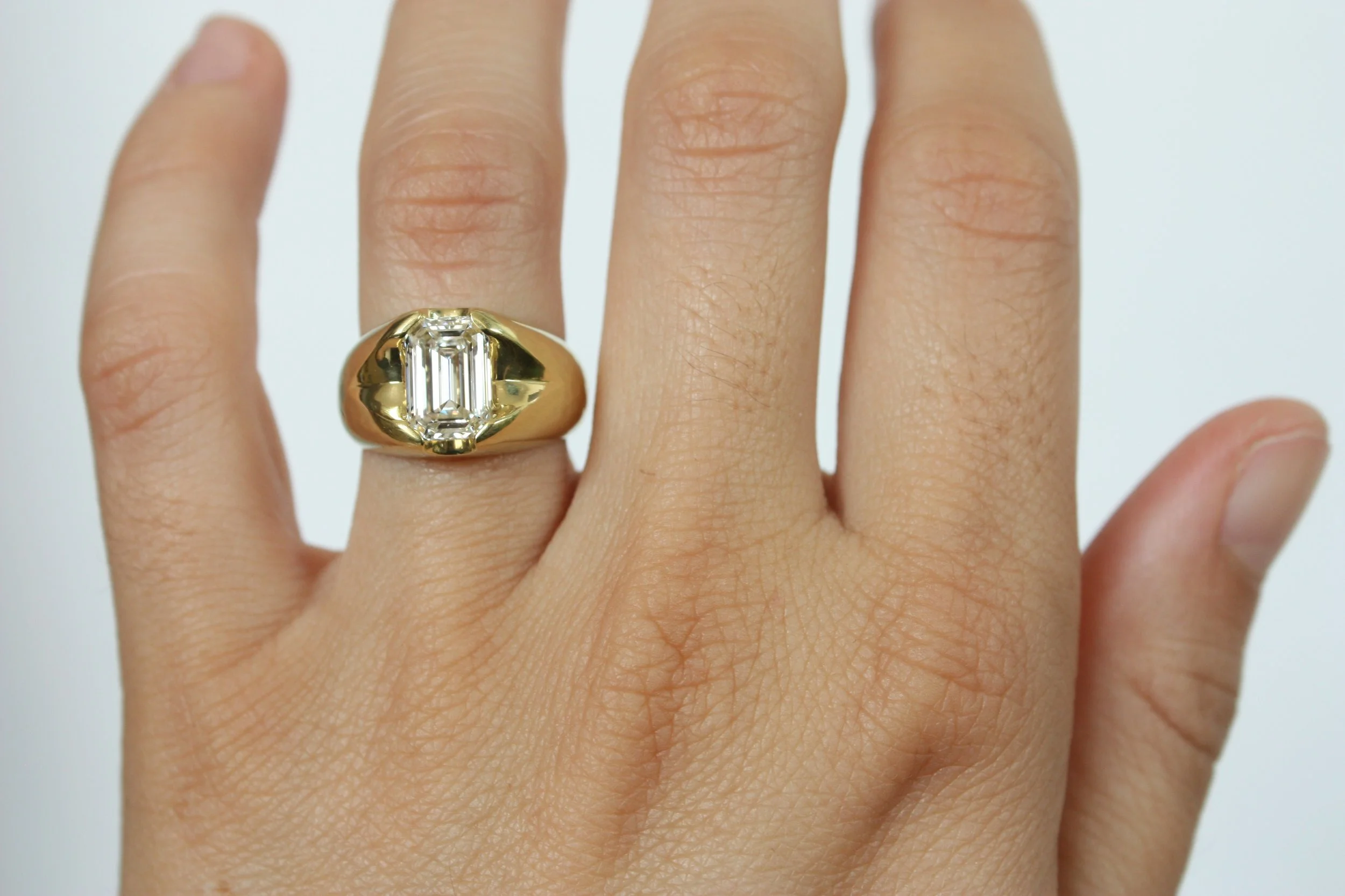 Emerald cut diamond chunky engagement ring by Bracken Jewelers