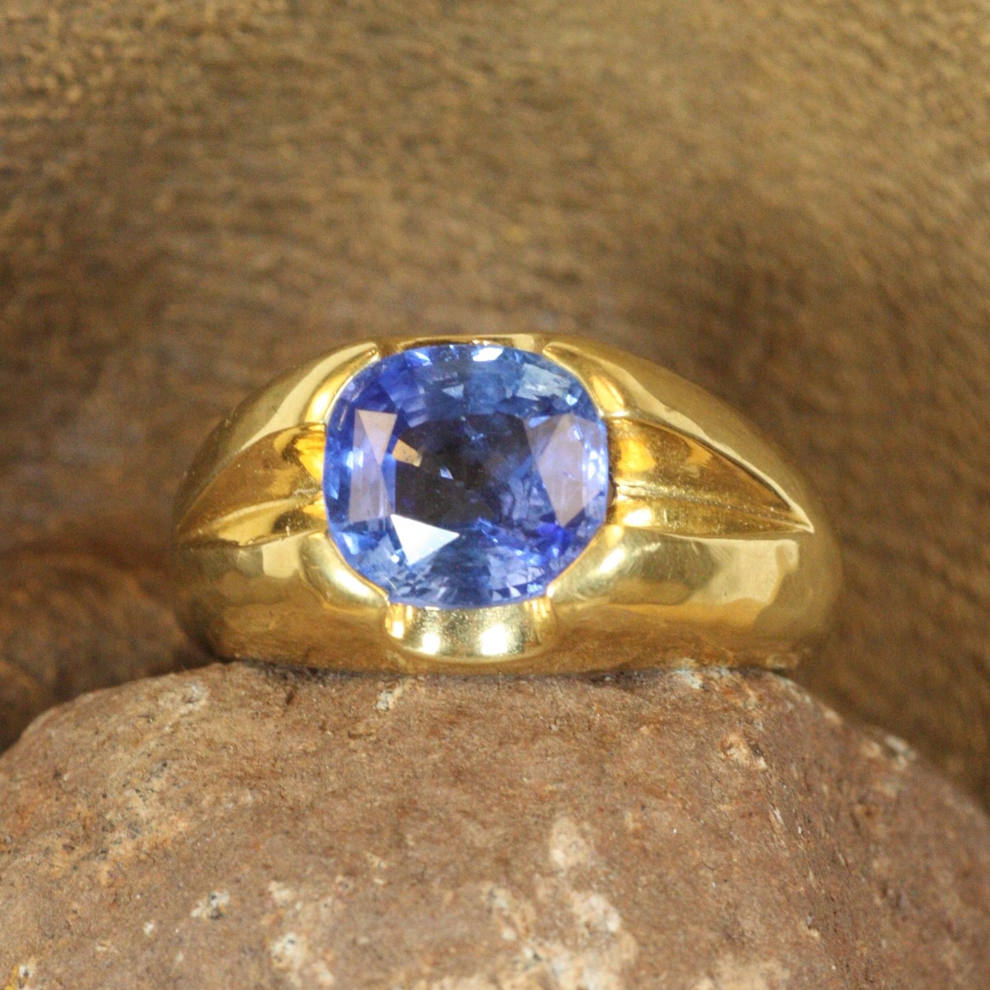 Would you call this a simple ring? 

After all, it is made of just two components.

Our designs are centered around accentuating the beauty of their natural elements&mdash;in this case, just 22K yellow gold and a 3.38ct Ceylon blue sapphire. Bringing