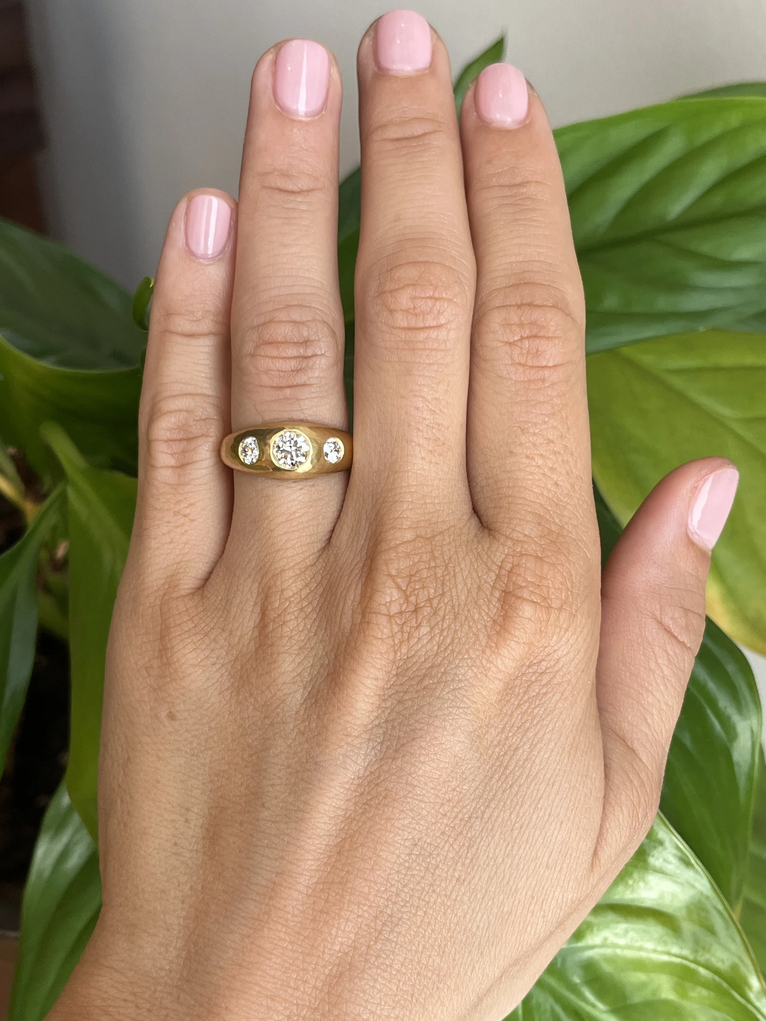 antique old mine cut diamond three-stone gypsy engagement ring on hand