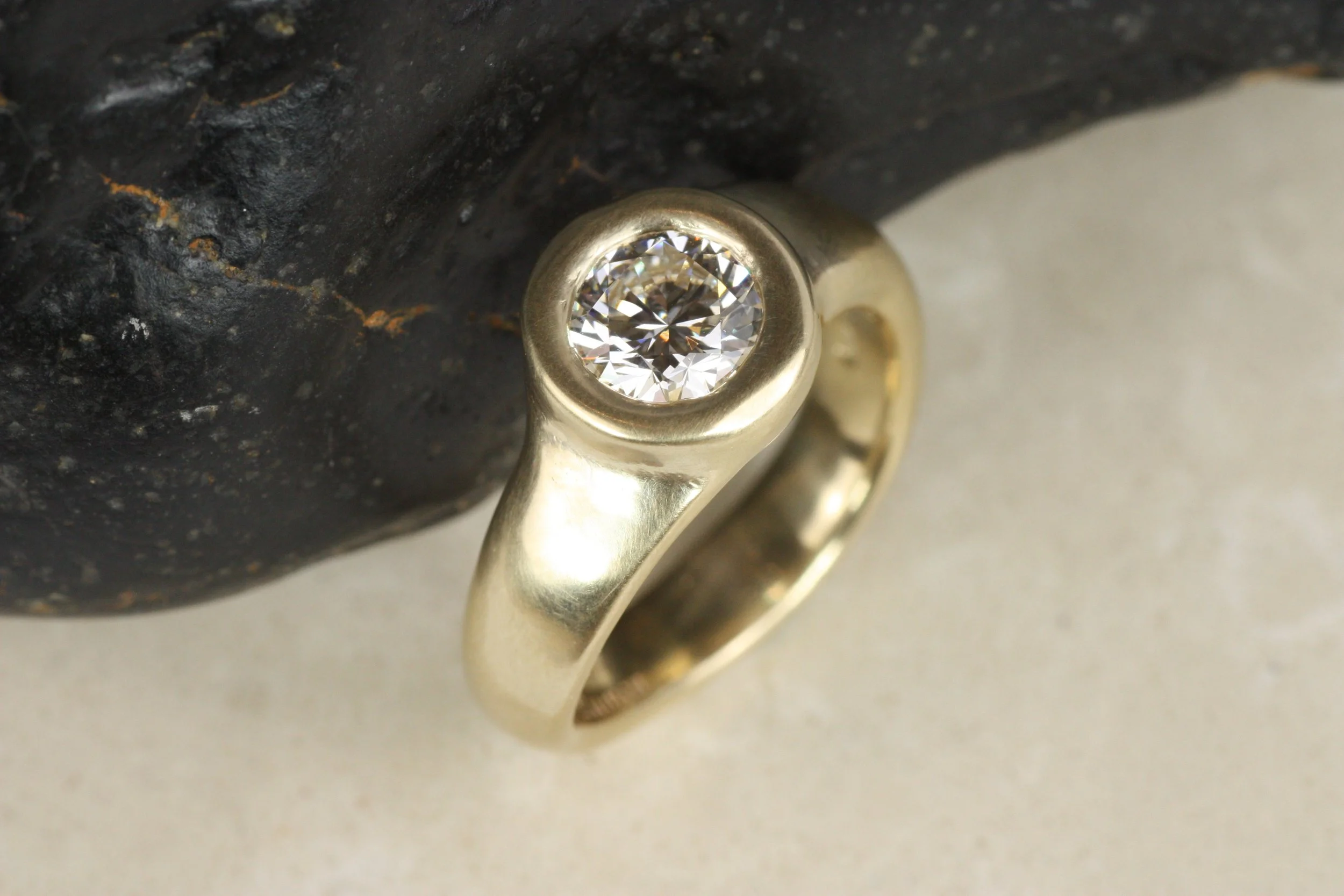 Round Diamond Curved Bezel Engagement Ring