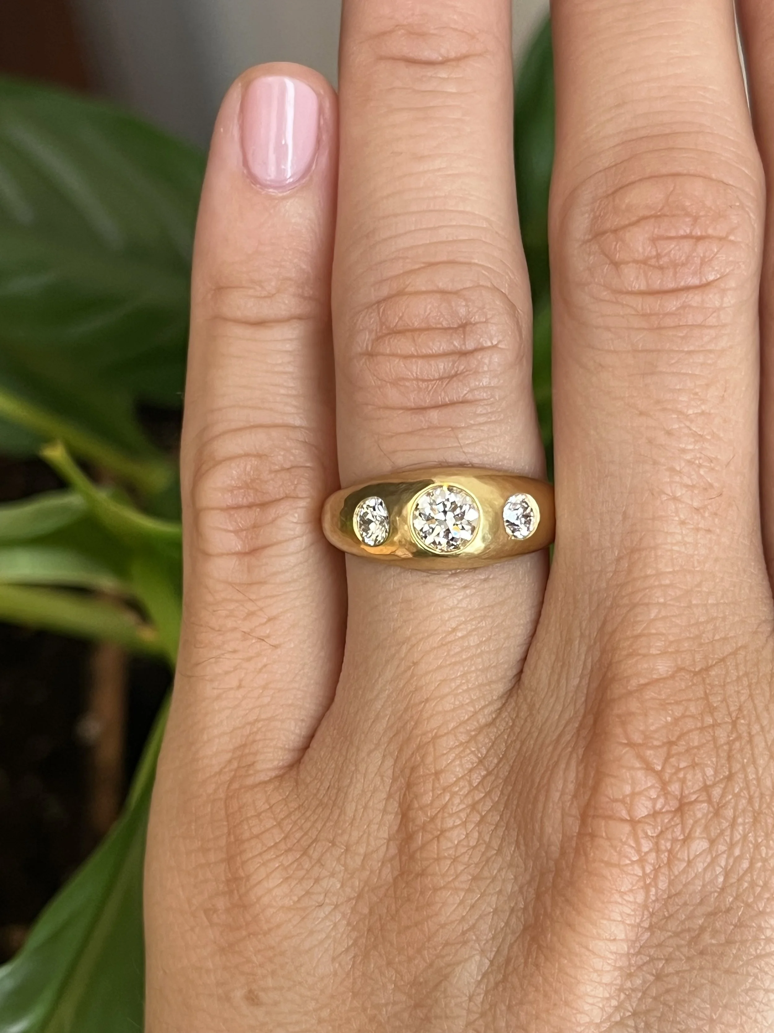 antique old mine cut diamond three-stone gypsy engagement ring on hand